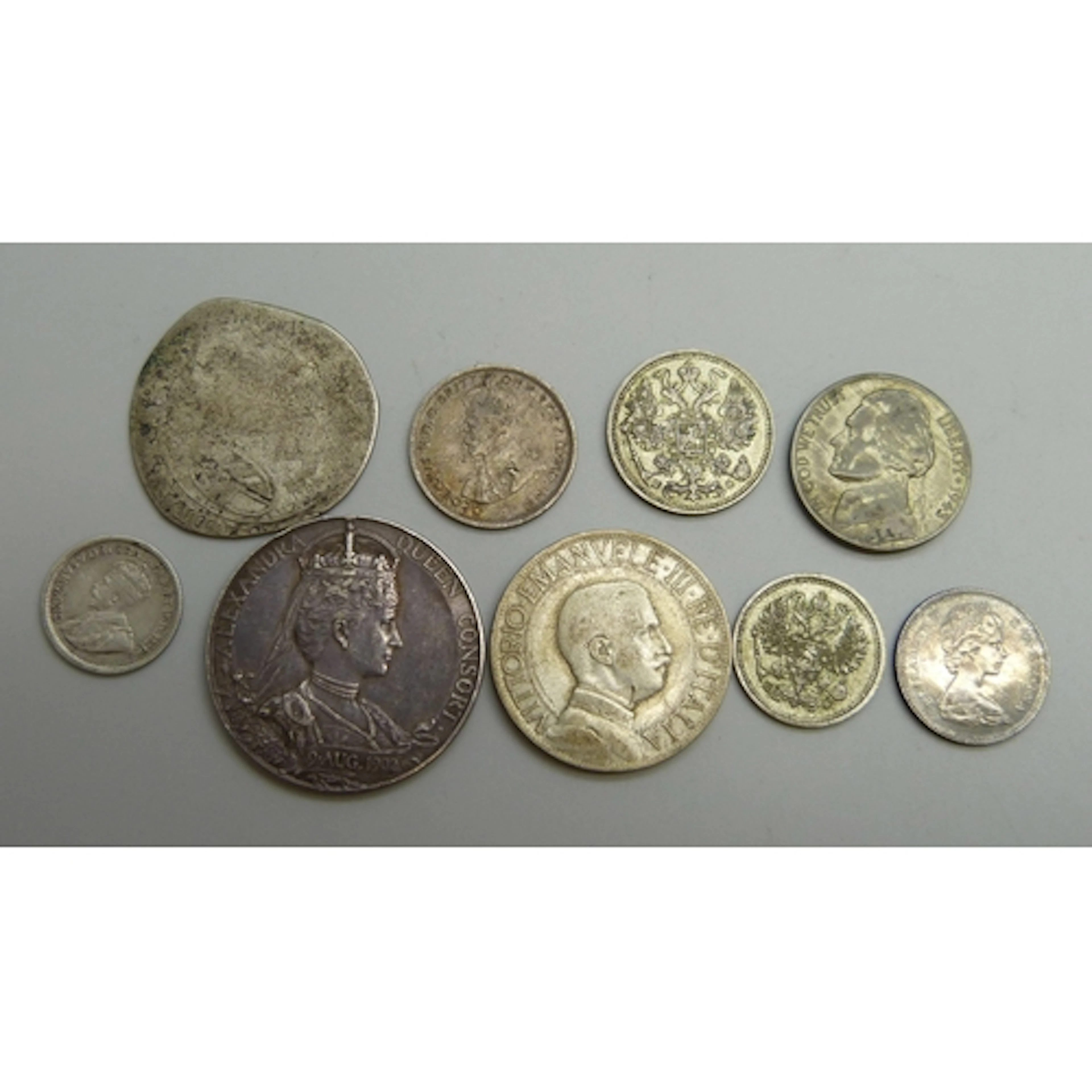 A collection of coins including Australia, Canada, Russia, a...