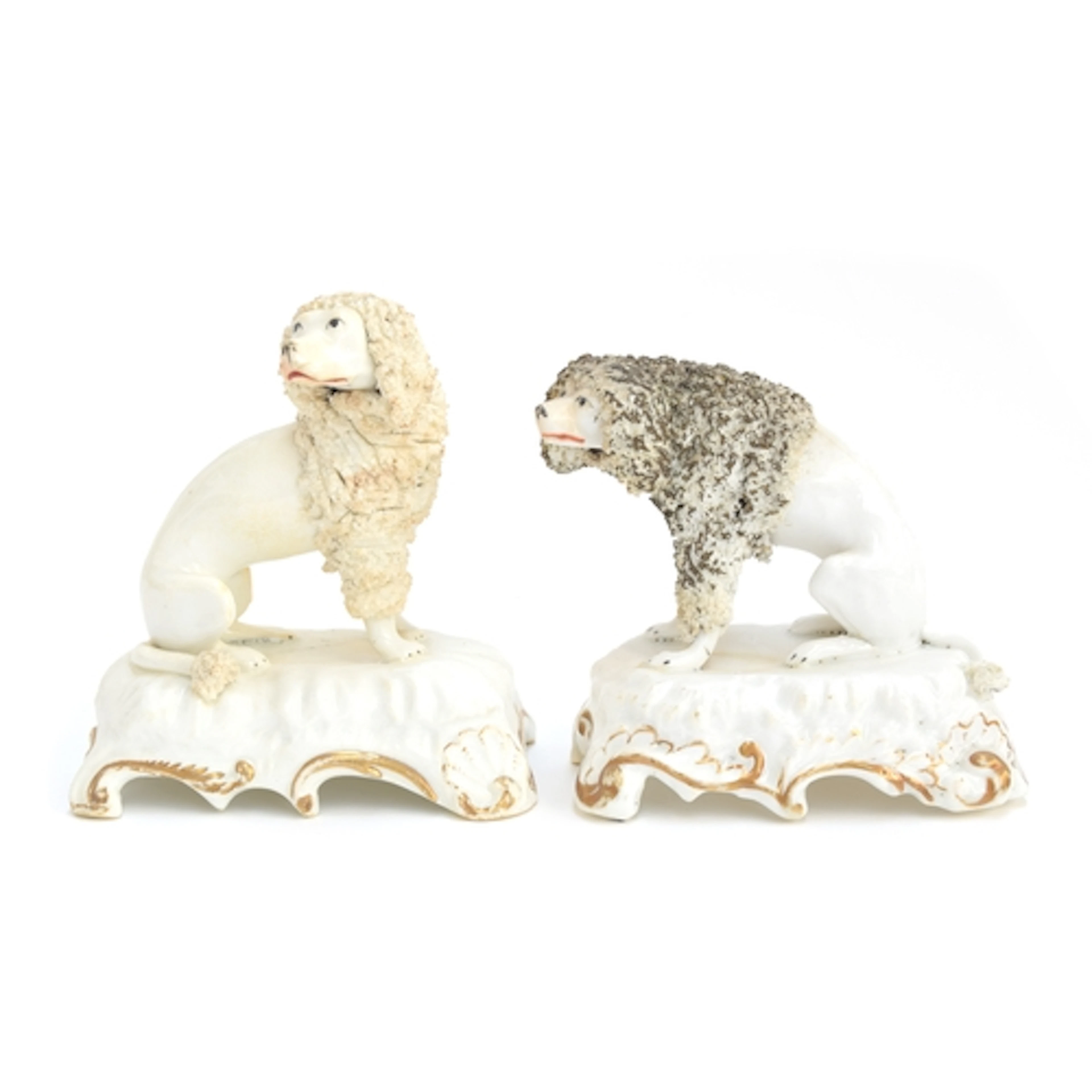 Two 19th century porcelain figures of poodles, likely Rockin...
