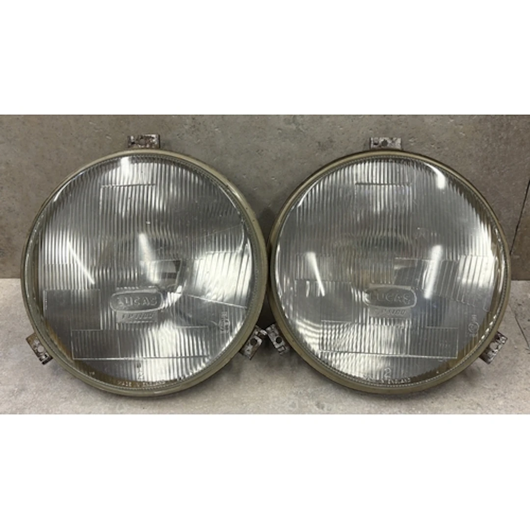 A pair of large format Lucas FP1100 11" headlamps. Est. £20 ...