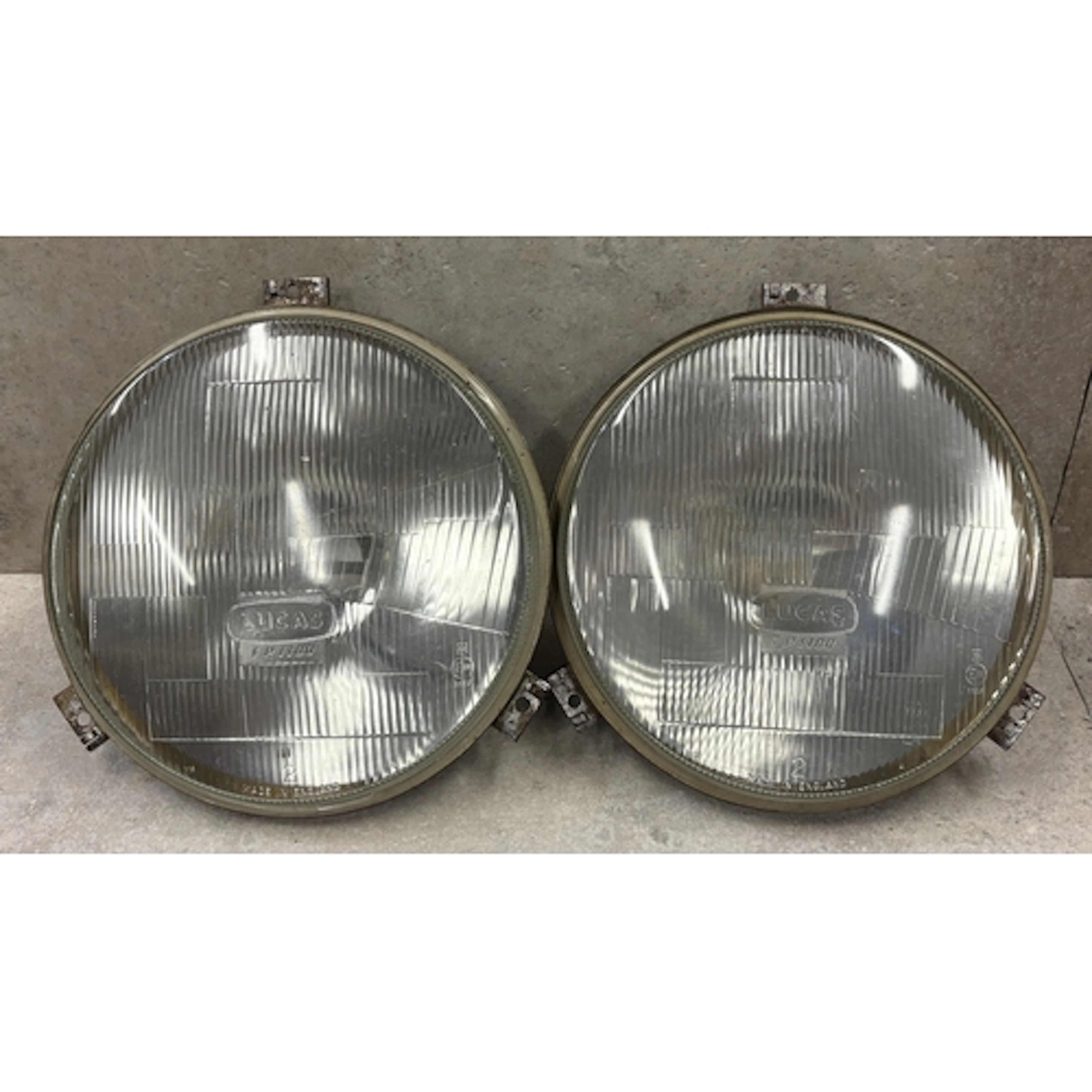 A pair of large format Lucas FP1100 11" headlamps. Est. £20 ...