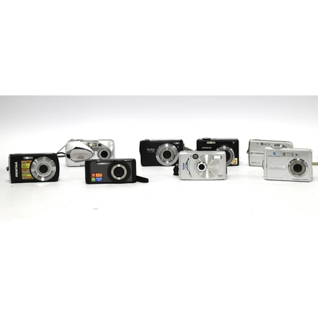 A large collection of Digital Compact Cameras to include Pen...