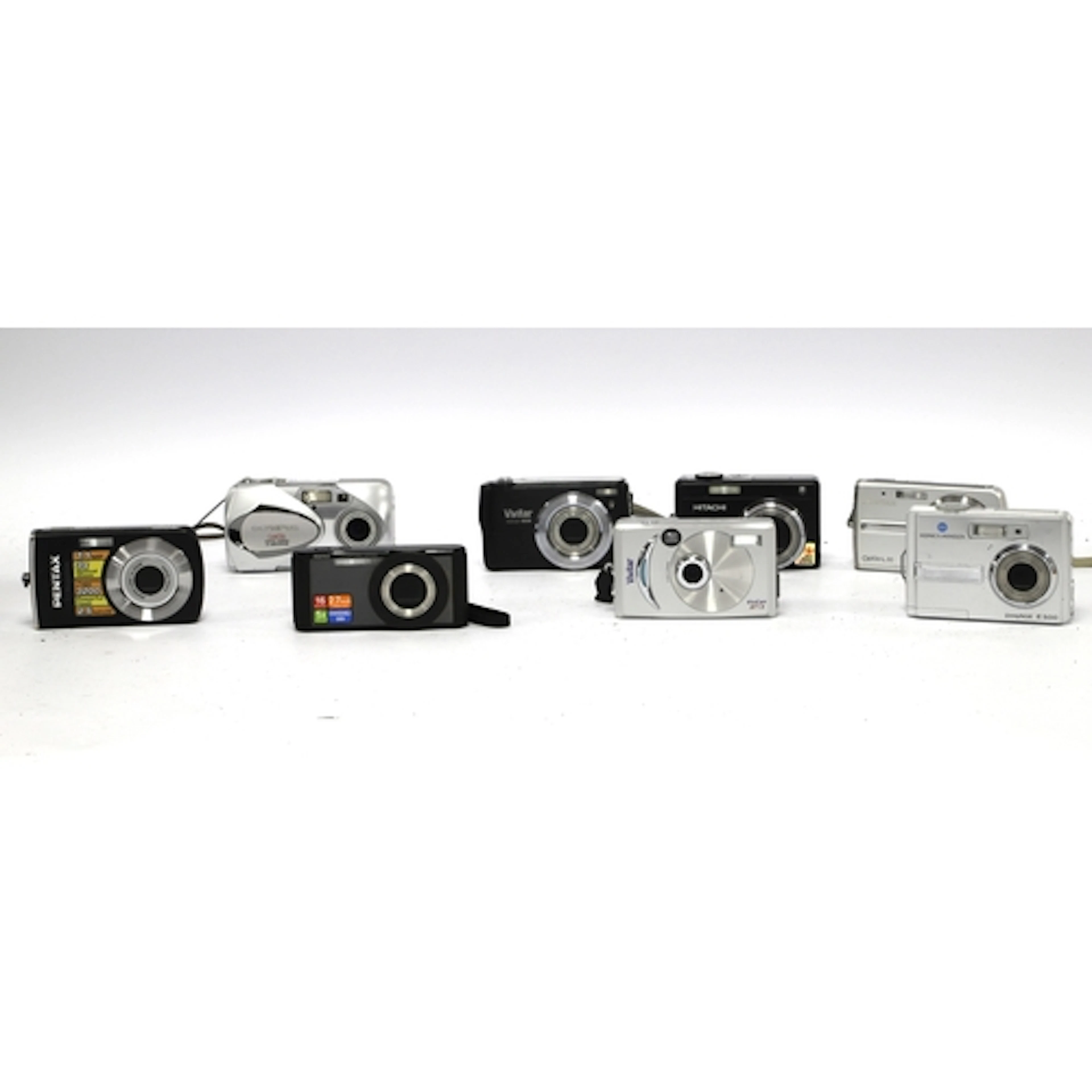 A large collection of Digital Compact Cameras to include Pen...