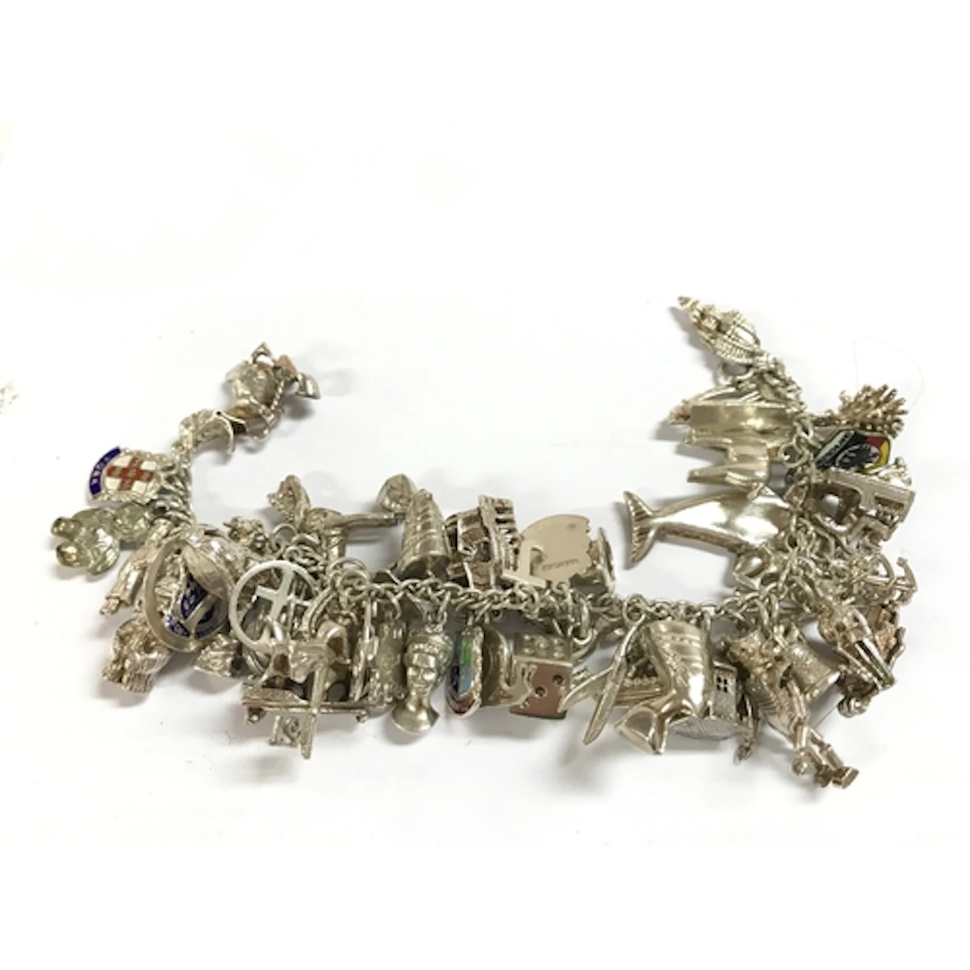 A heavy silver charm bracelet 117g total weight