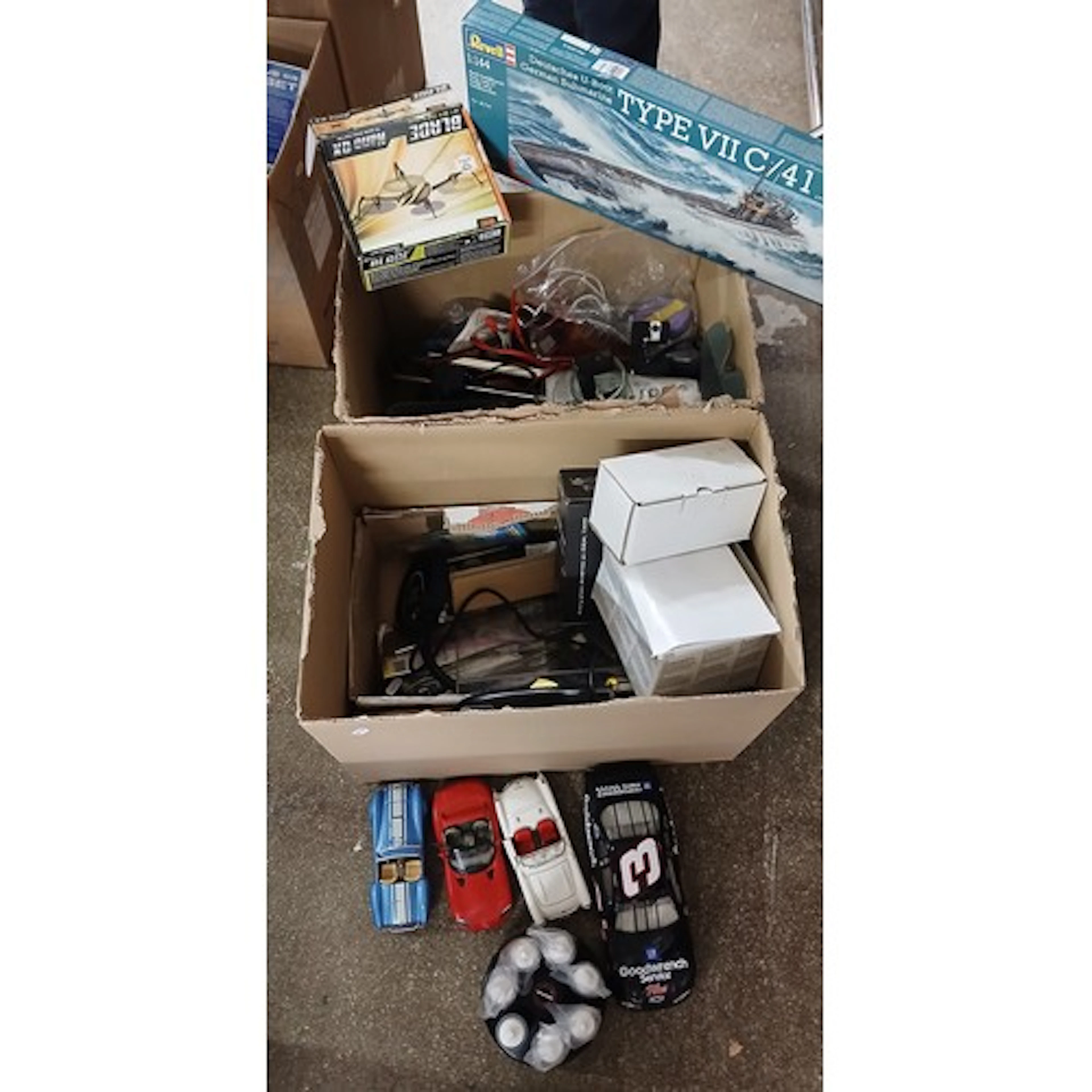 Two boxes loose parts of model planes, cars, etc.