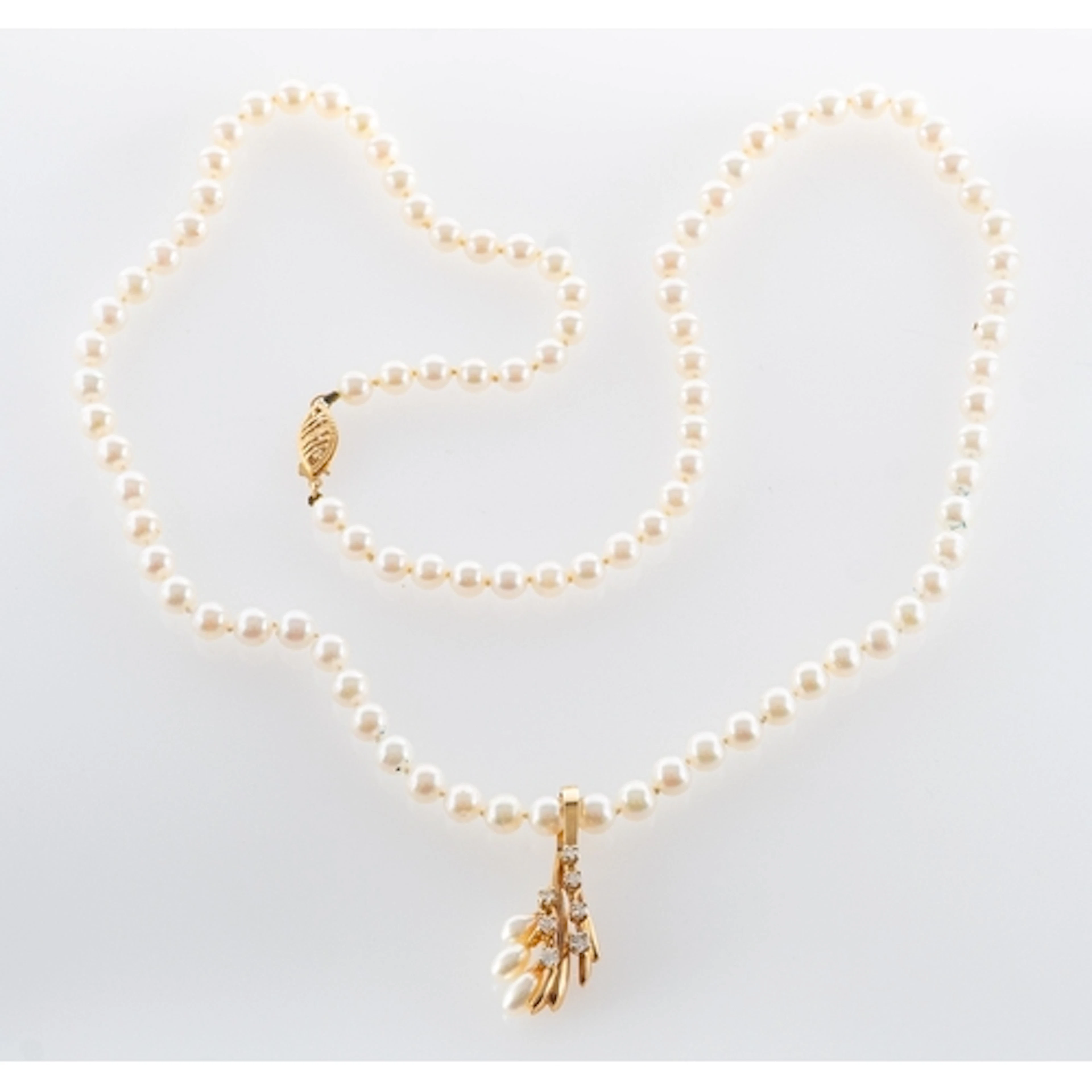 An Akoya cultured pearl necklace with detachable diamond and...