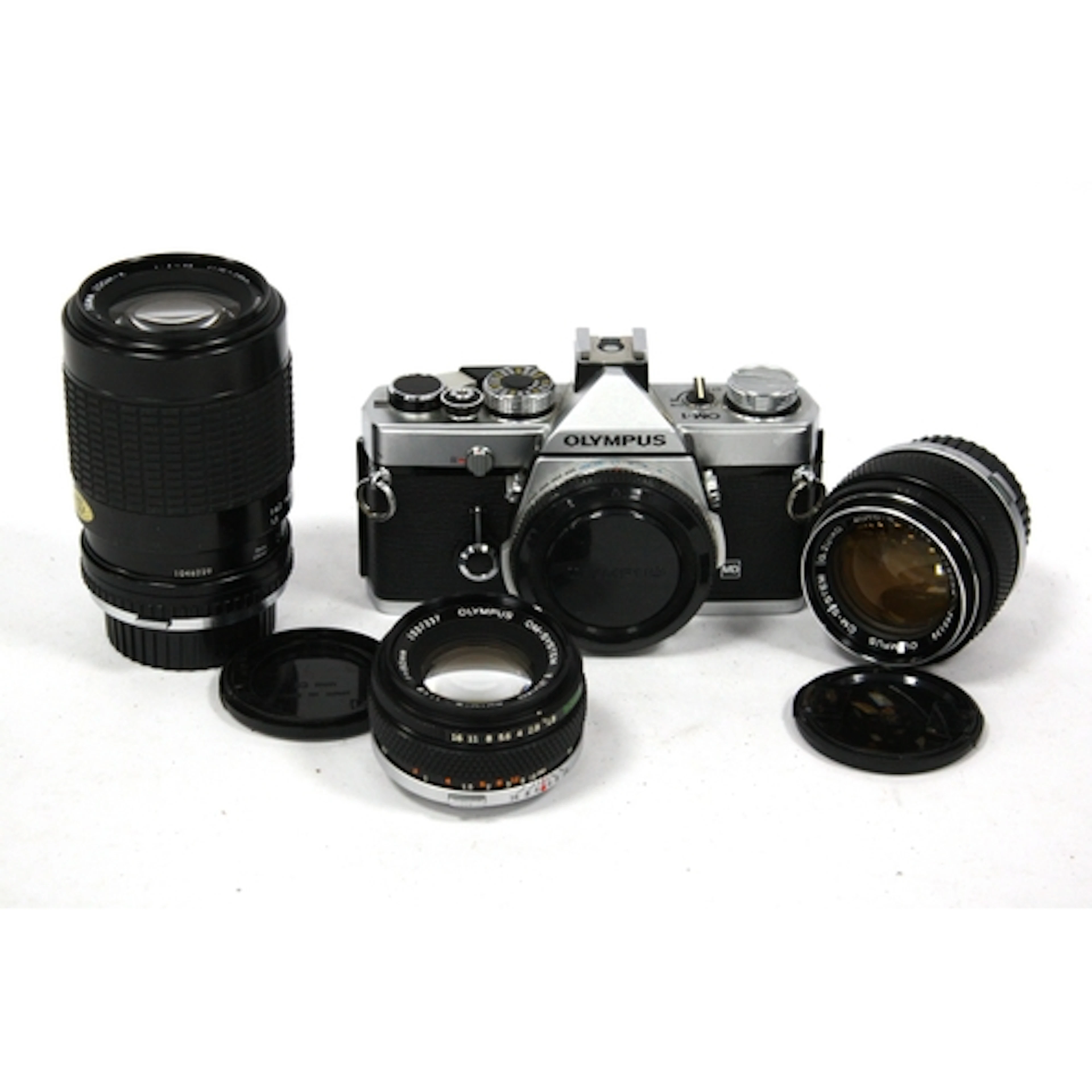 Olympus OM-1 MD 35mm SLR Film Camera Body together with a qu...