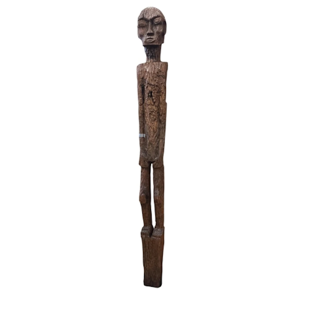 A carved scarecrow, created from a World War II railway slee...