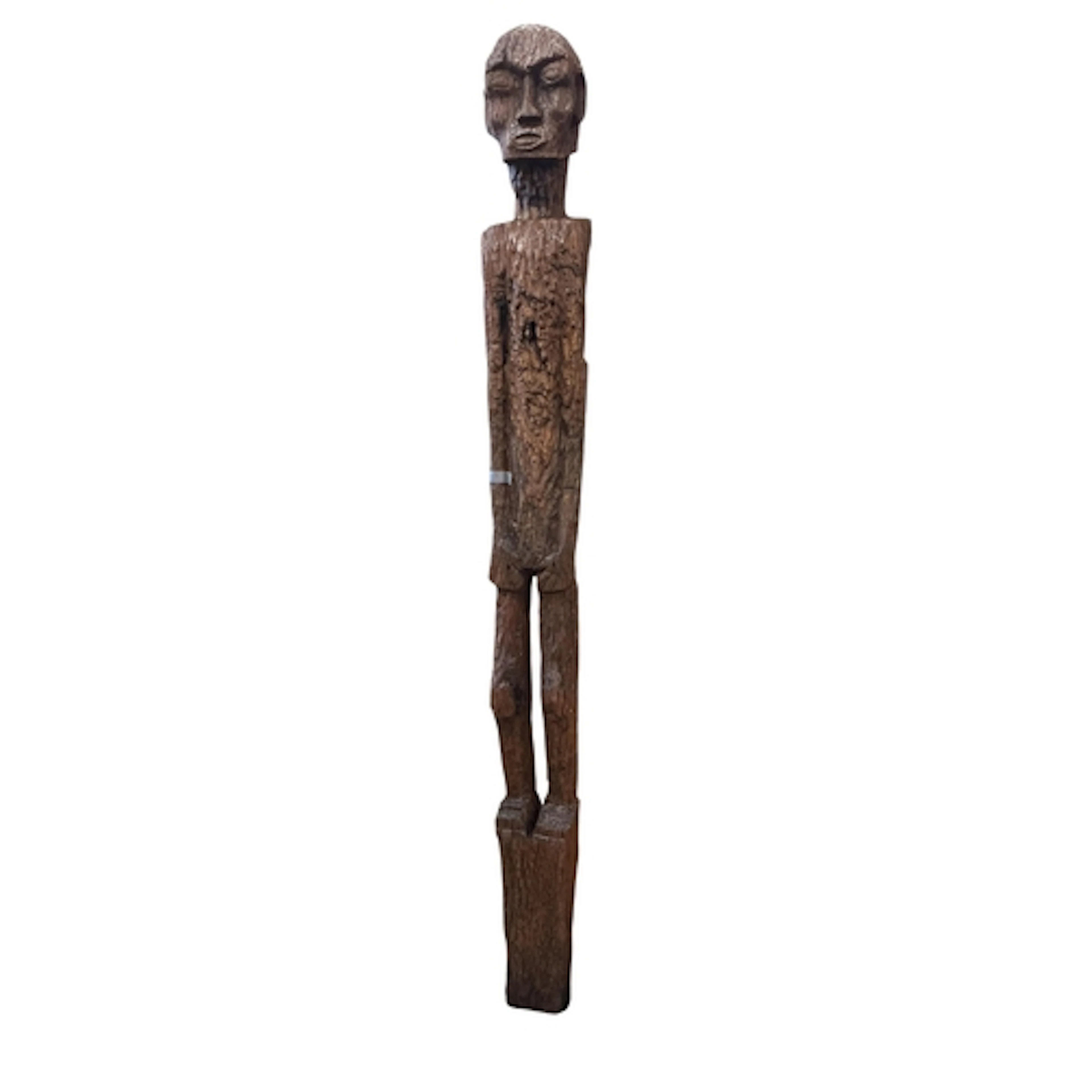 A carved scarecrow, created from a World War II railway slee...