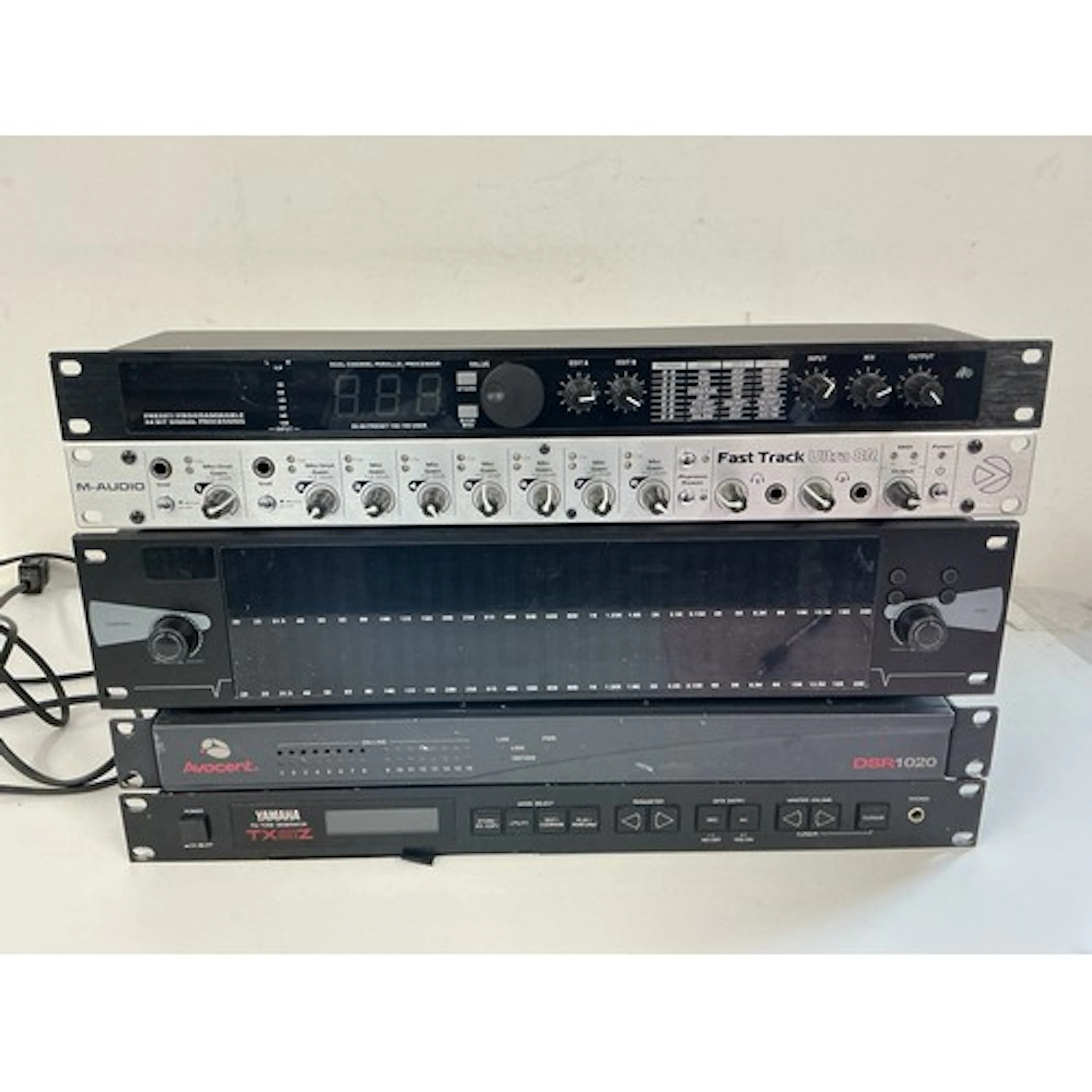 Five rack effects units comprising a Yamaha TX81Z FM tone ge...