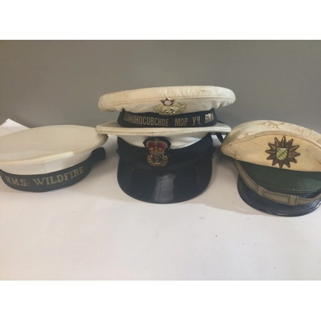 A collection of cloth Caps. HMS Wildfire RAF German Police R...