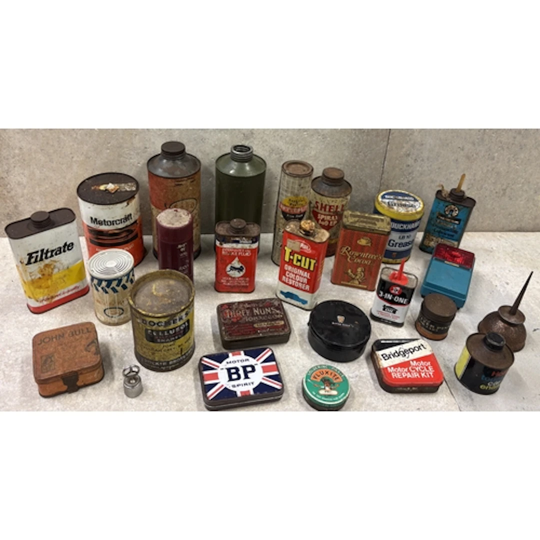 A vintage Esso Lube Motor Oil quart can together with variou...