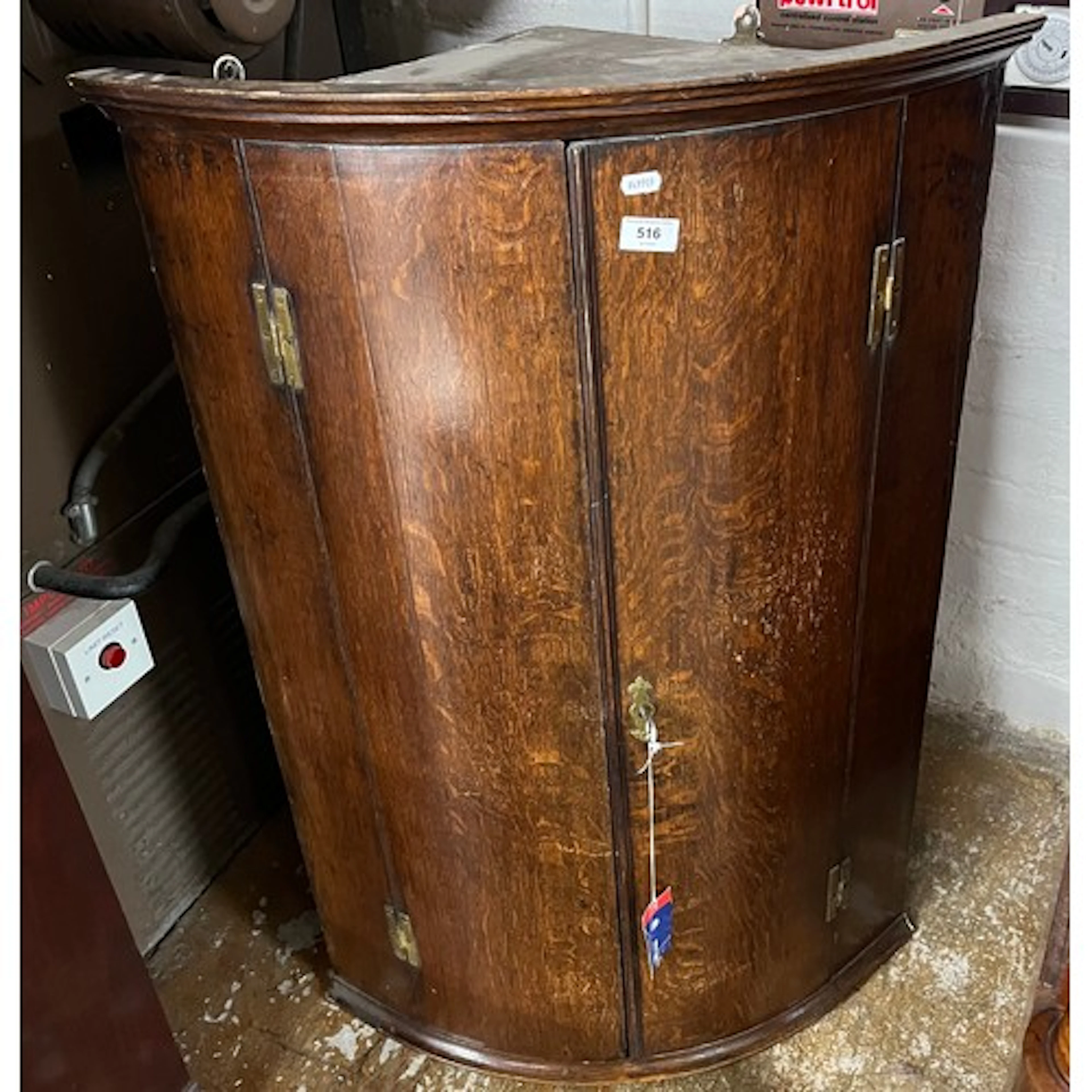 Georgian oak wall mounted corner cabinet with three interior...