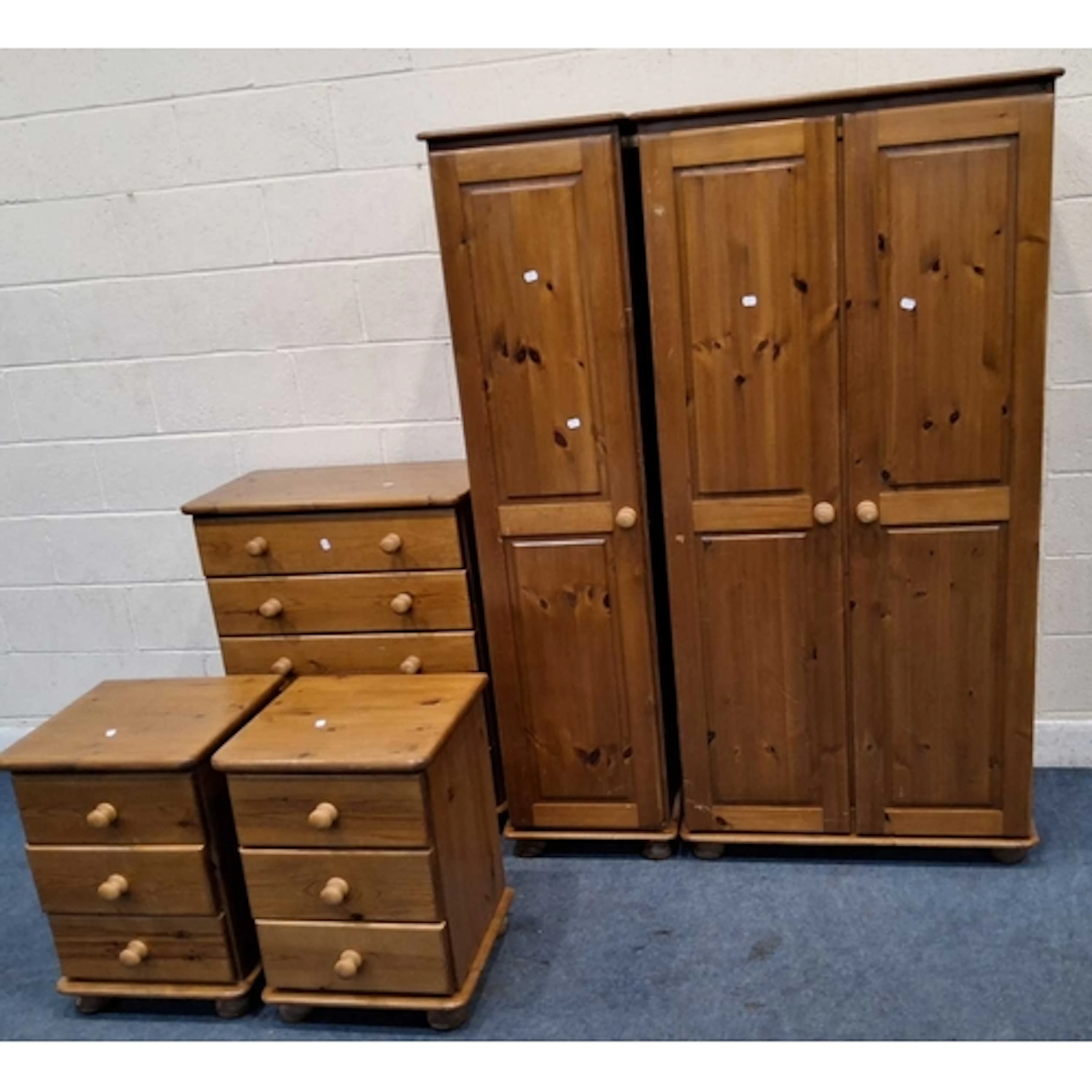 A MODERN PINE DOUBLE DOOR WARDROBE, a matching single door c...