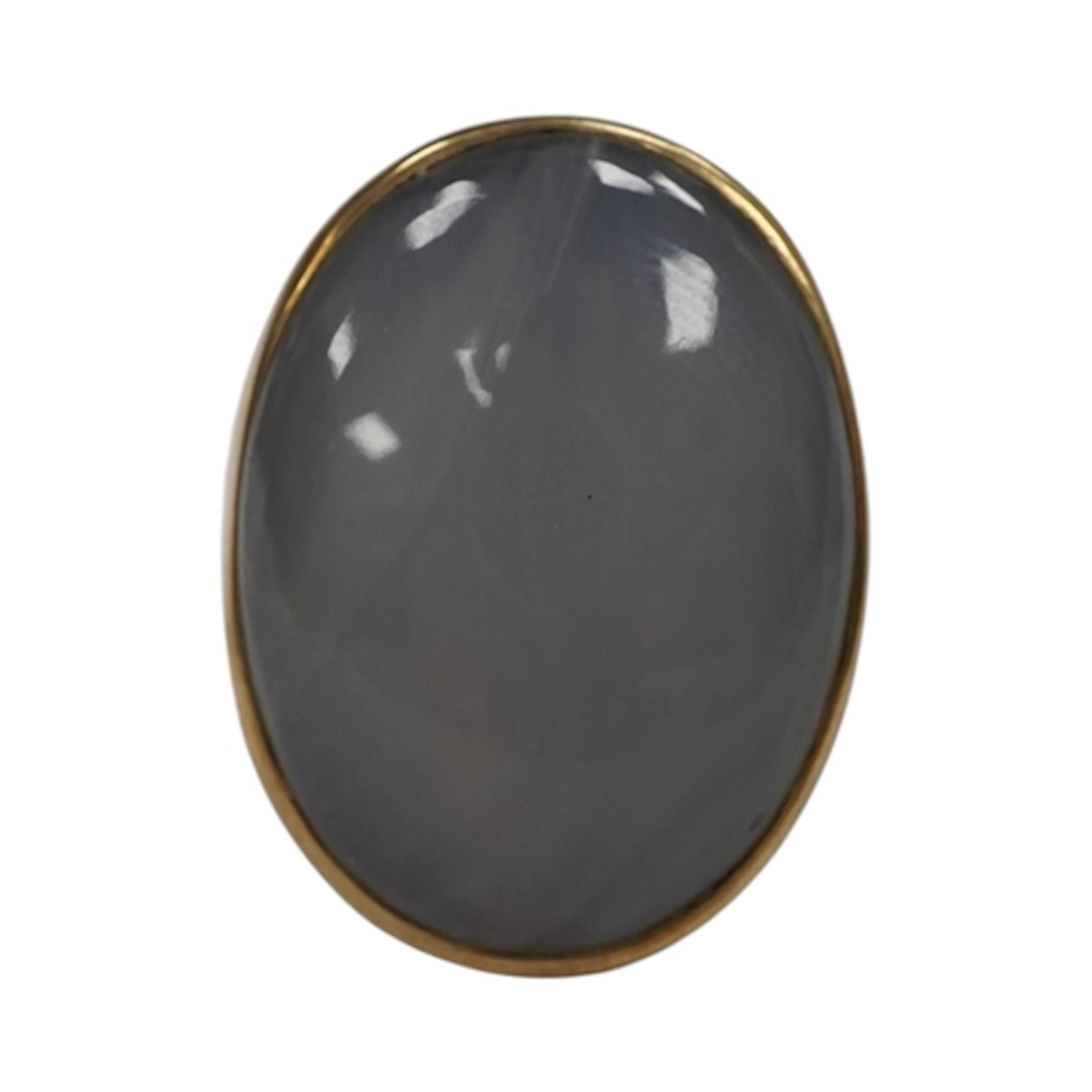 A large gold and chalcedony signet ring, collet-set with a c...