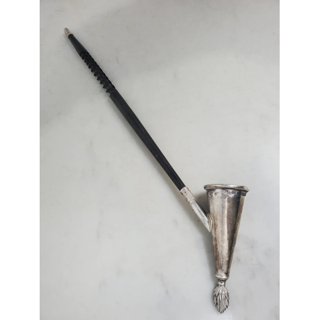 An Elizabeth II silver Candle Snuffer with torch finial and ...