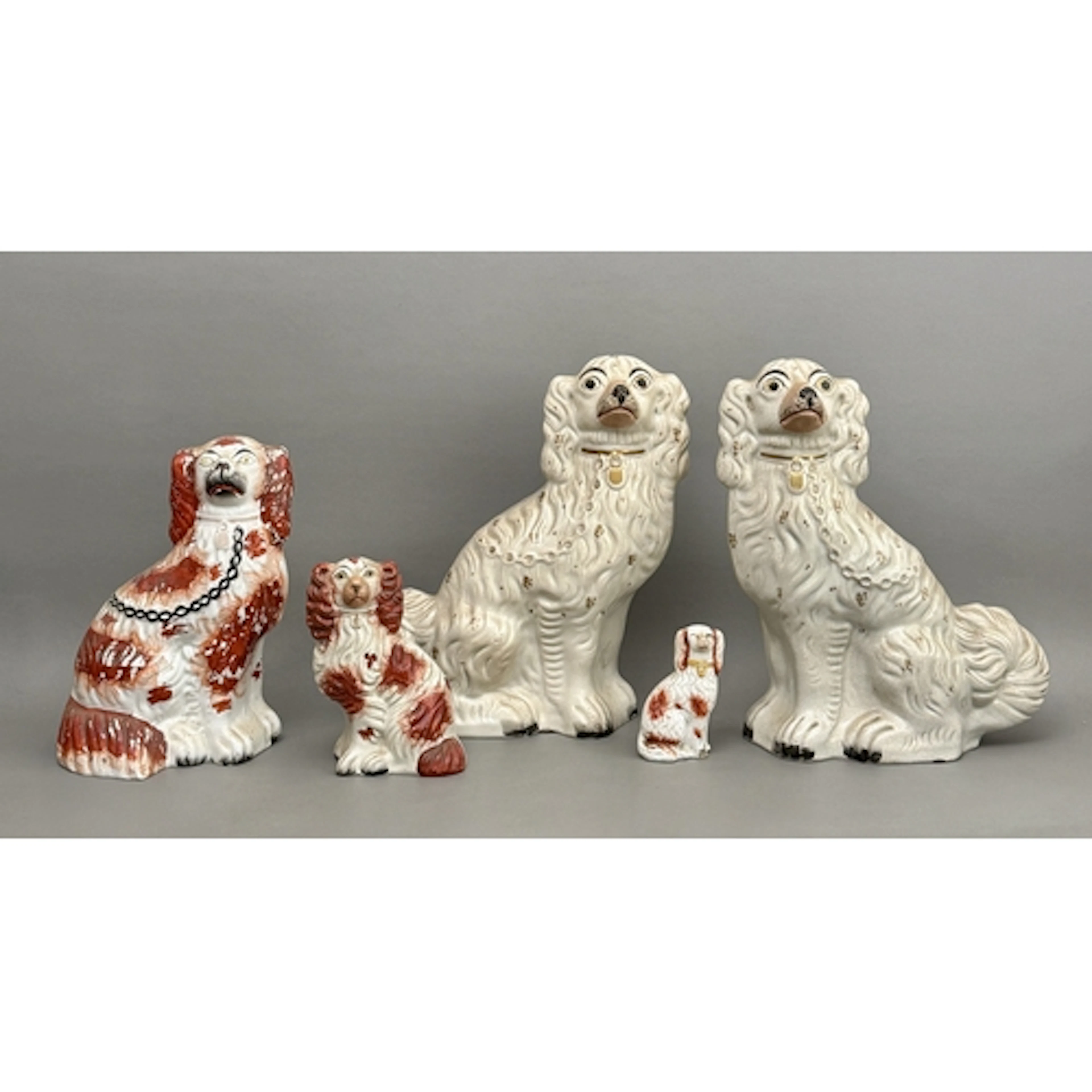 A group of nineteenth century Staffordshire spaniels - to in...