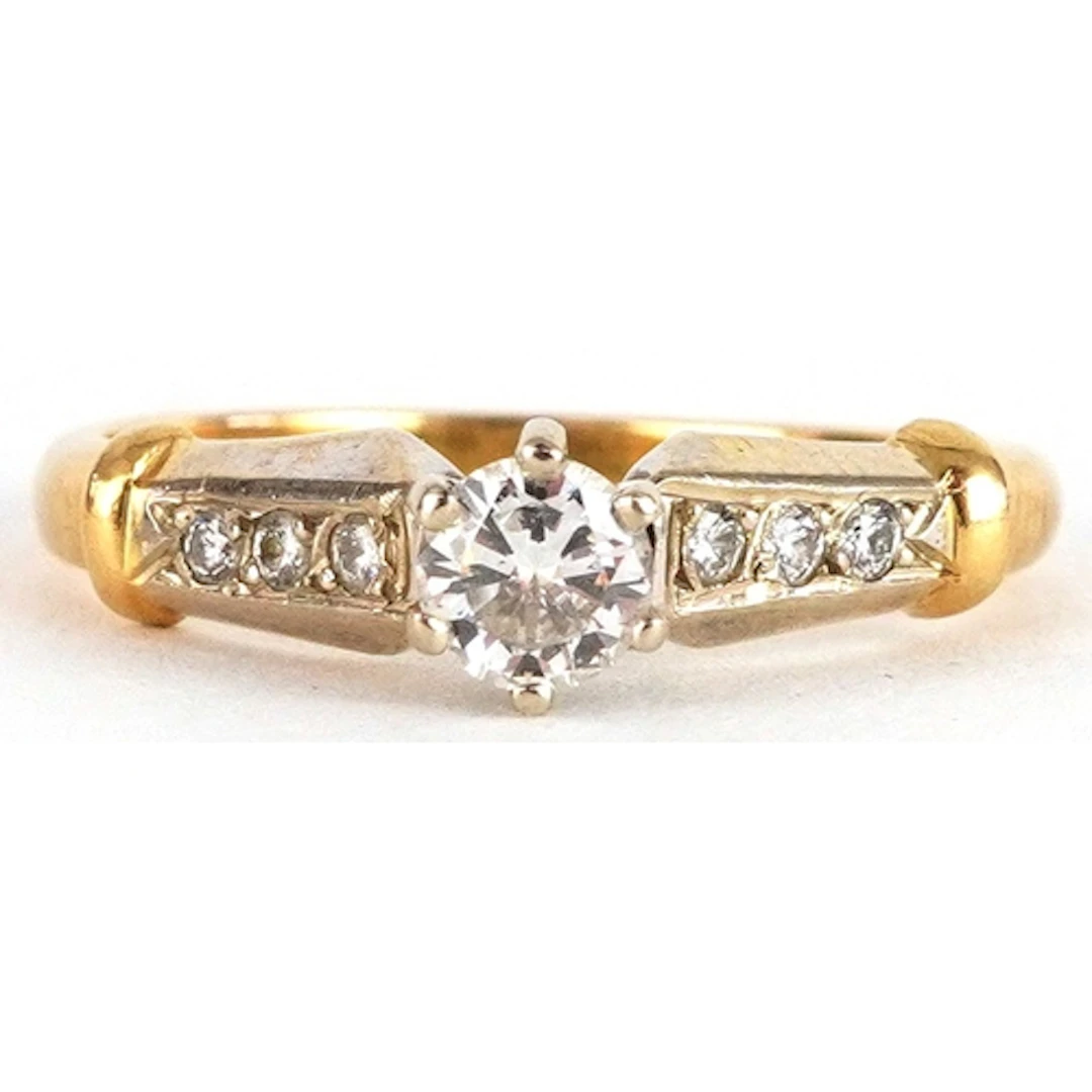 18ct gold diamond solitaire ring with diamond set shoulders,...