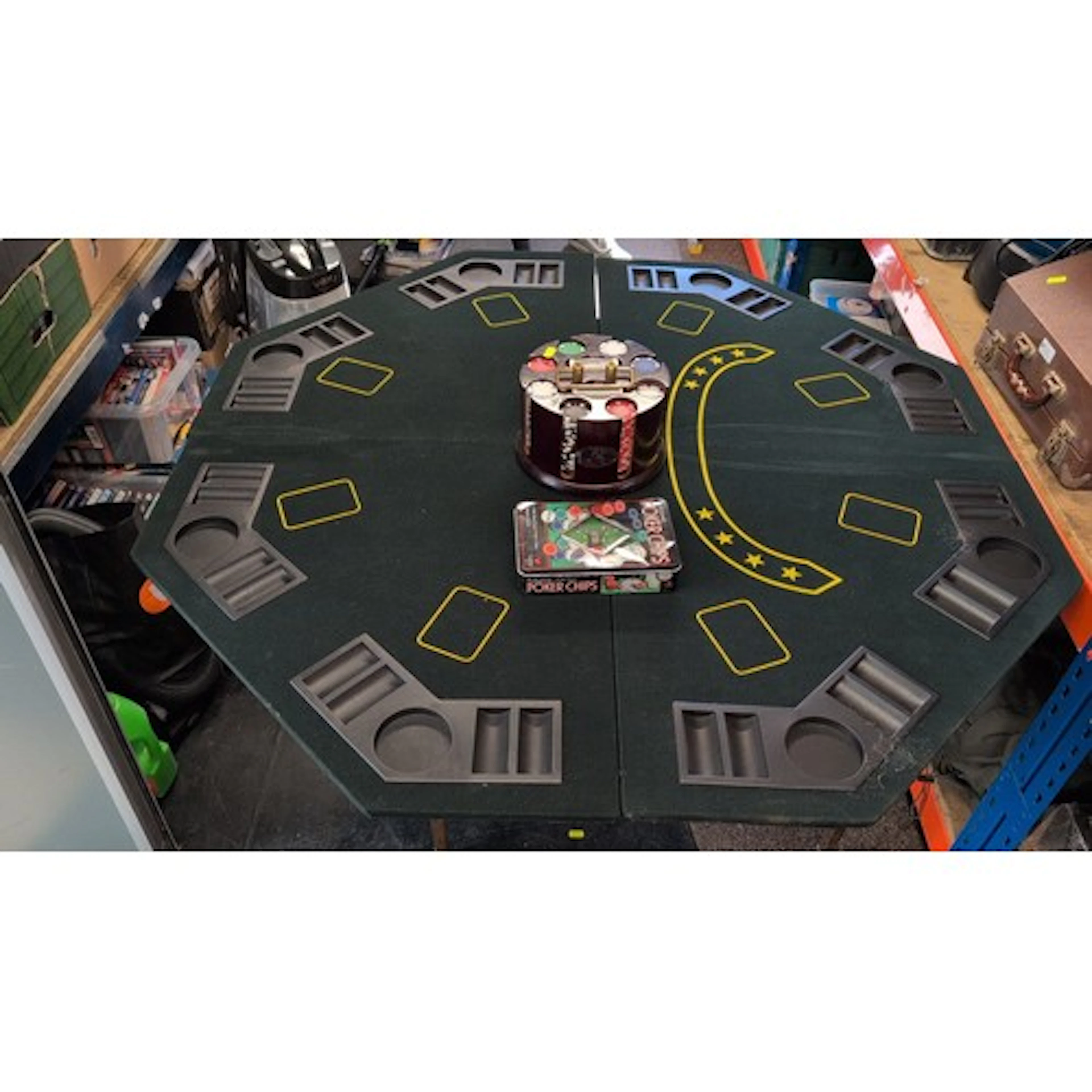 Fold-over octagonal poker table with green felt surface, mou...
