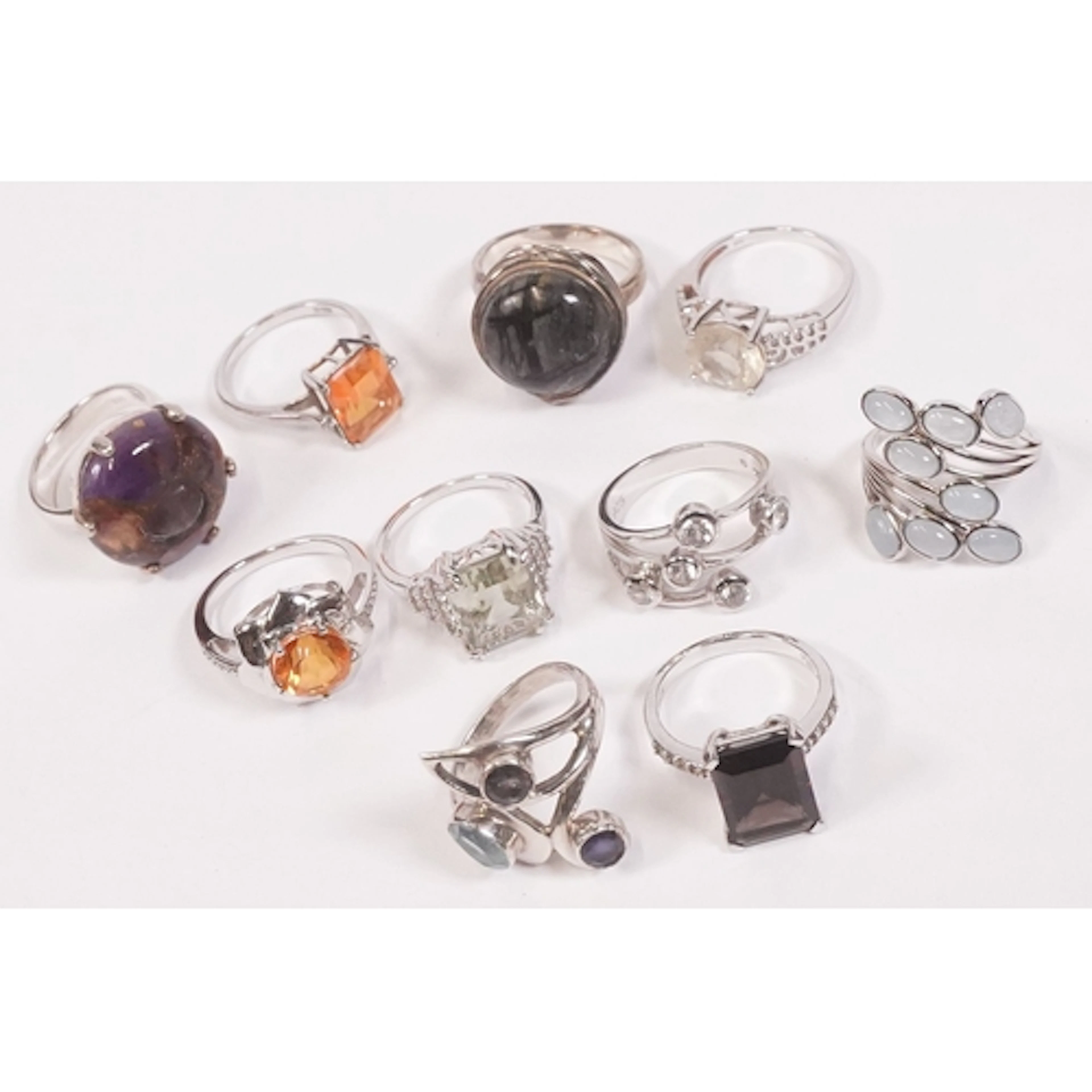 Ten sterling silver stone set rings to include a cluster rin...