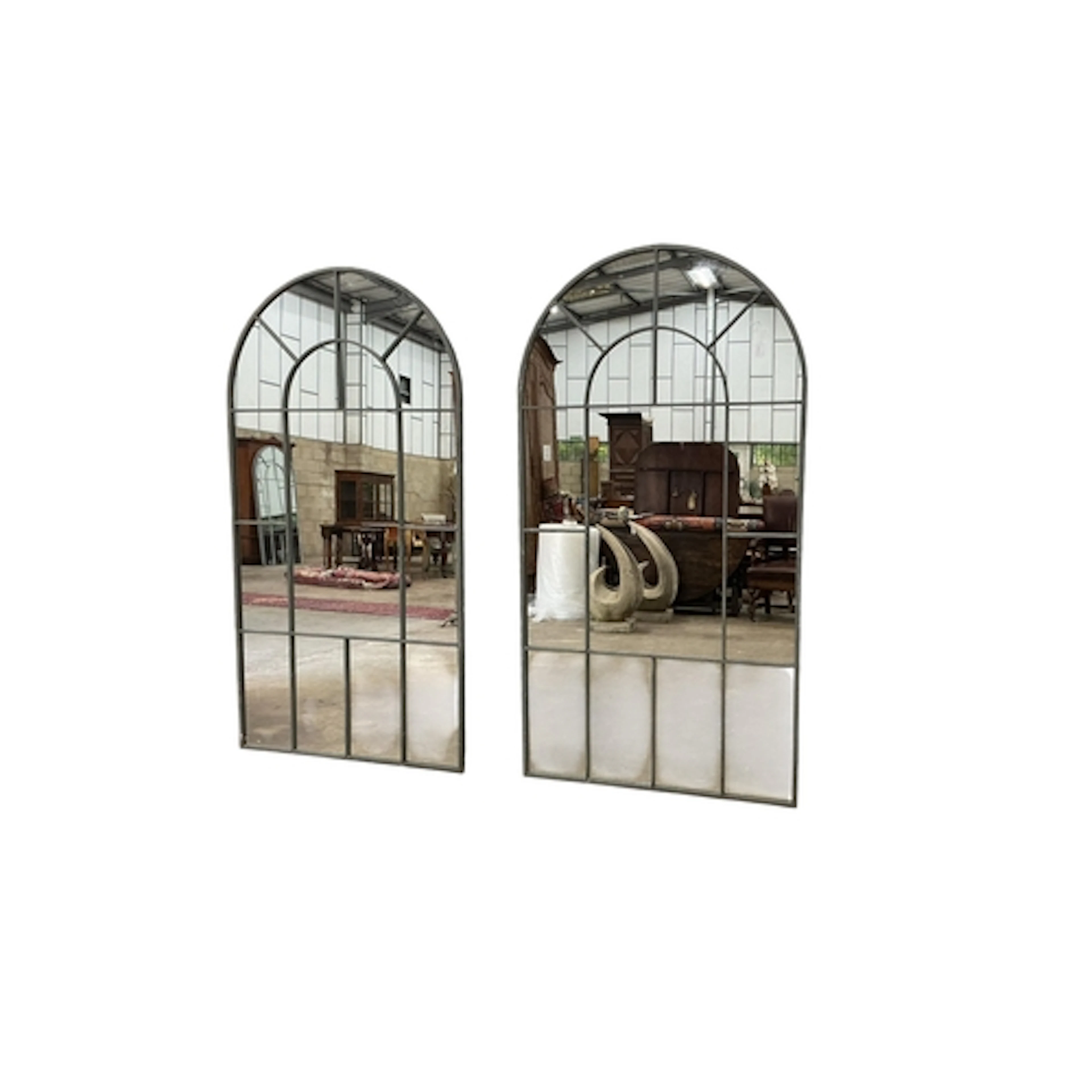 A pair of industrial style arched window frame style mirrors...