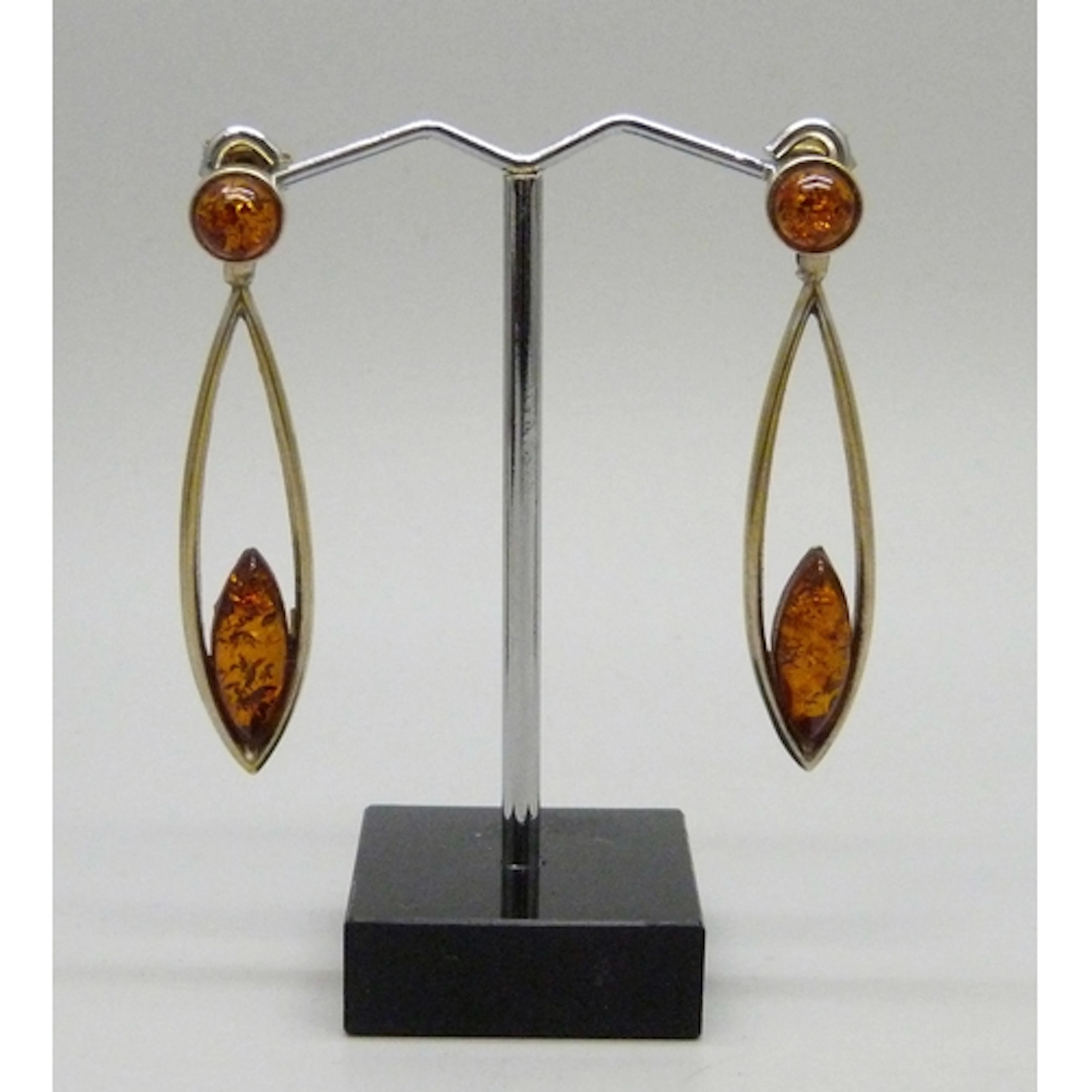 A pair of silver gilt and faux amber drop earrings, gilt wor...