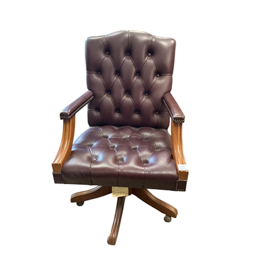A reproduction buttoned swivel desk chair, width 63cm, depth...