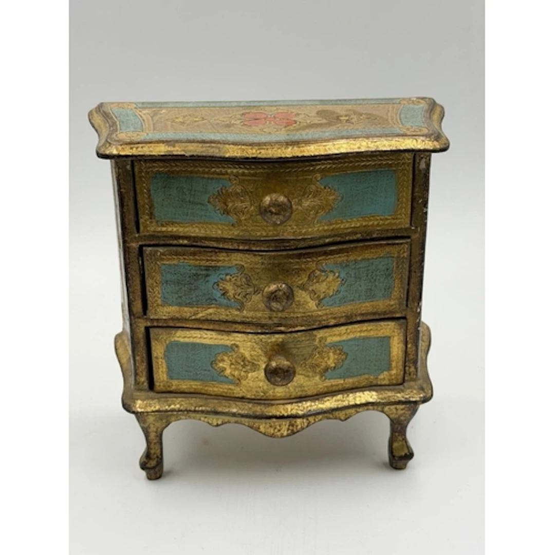 A Florentine miniture chest of drawers, bow fronted shape wi...