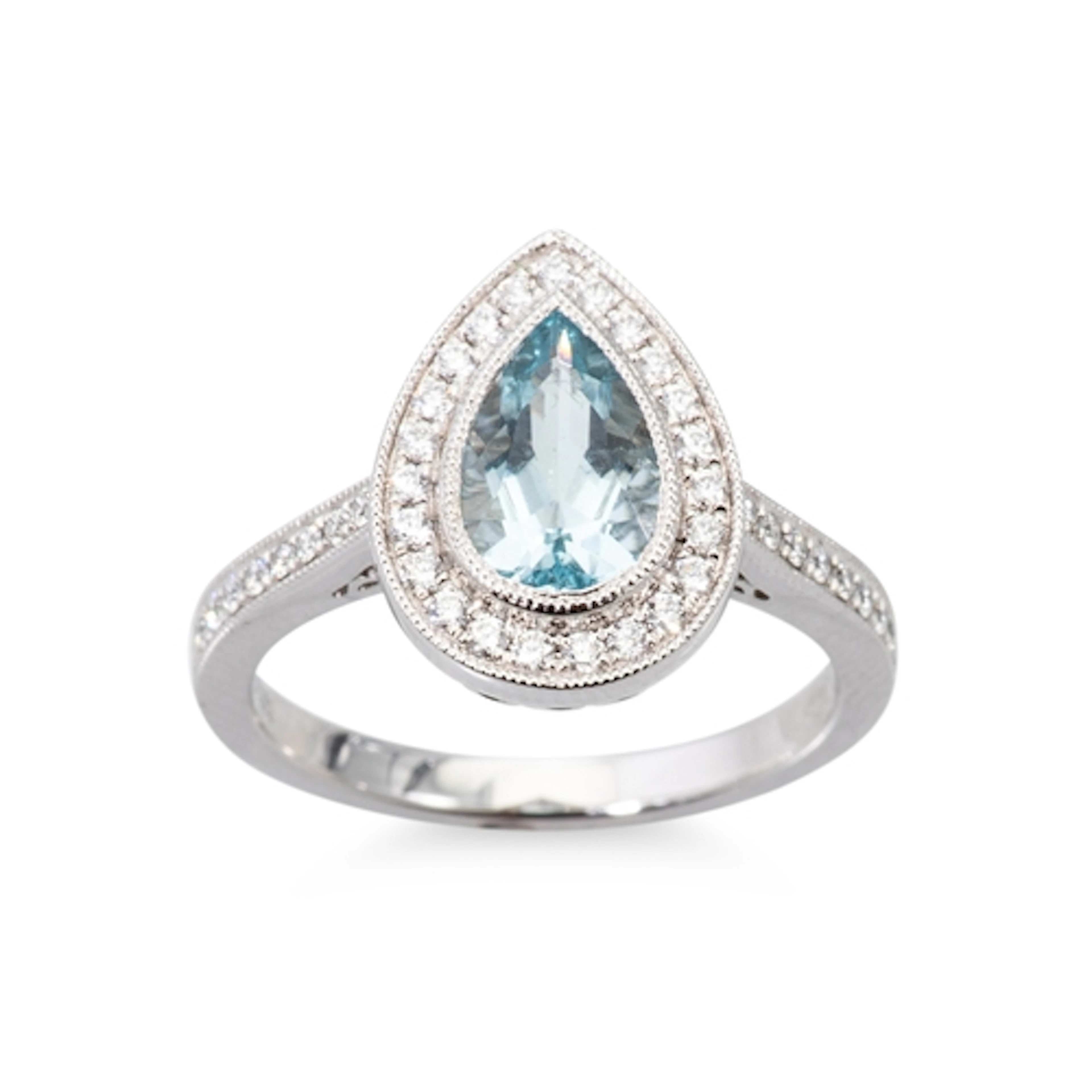 AN AQUAMARINE AND DIAMOND CLUSTER RING, the central pear cut...