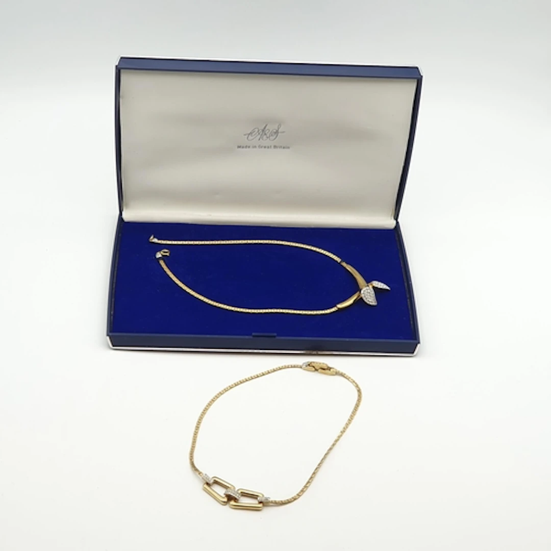 Two gold-tone Atwood & Sawyer Necklaces both set white stone...