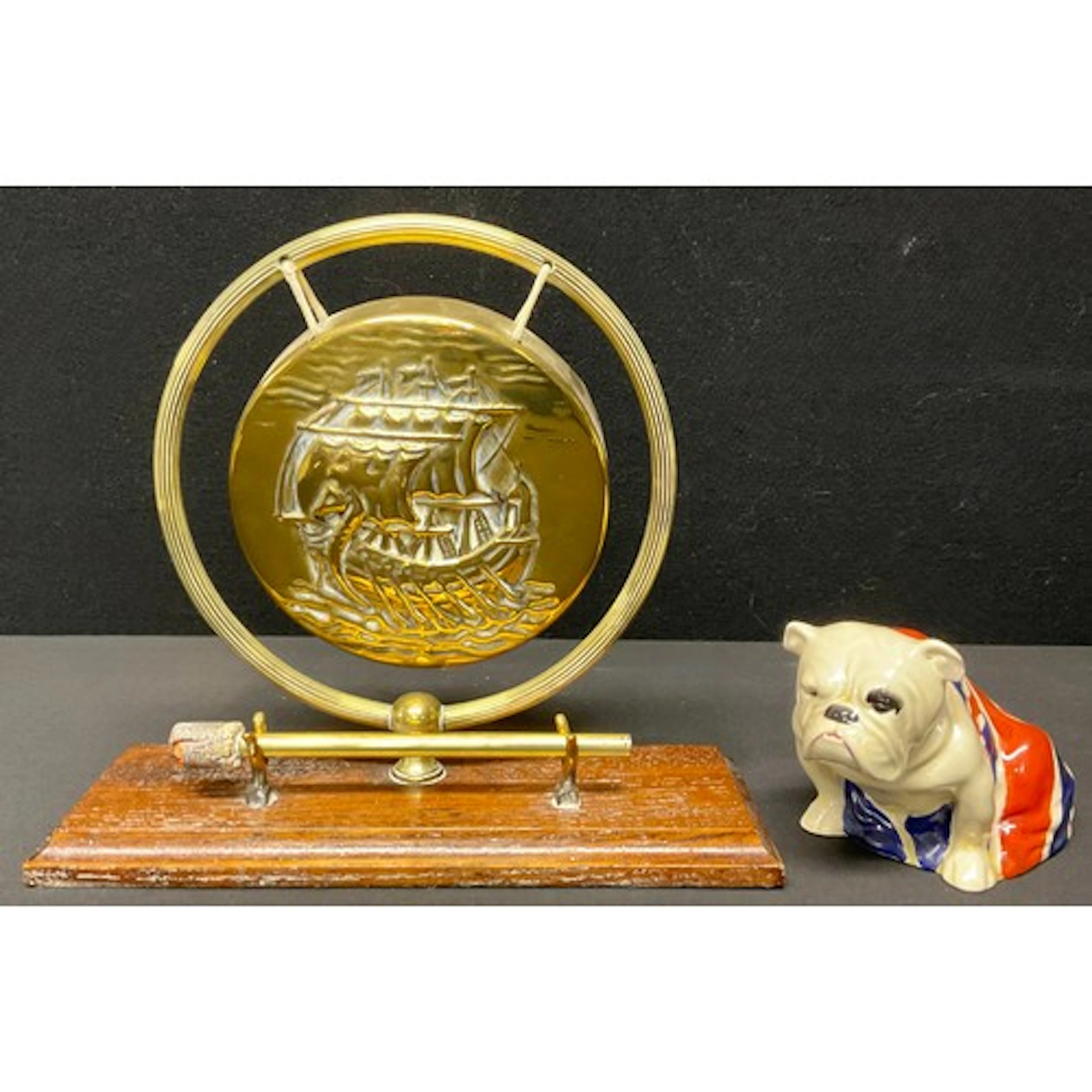 A Royal Doulton model, of a British Bulldog, seated and drap...
