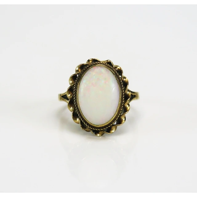 A 9ct gold opal dress ring in a rope twist setting, c. 13.5 ...