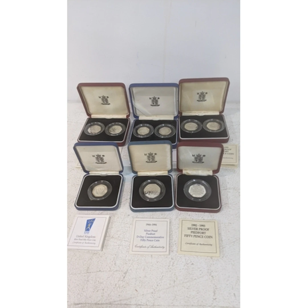 Boxed Royal Mint silver coinage to include an NHS 50th anniv...
