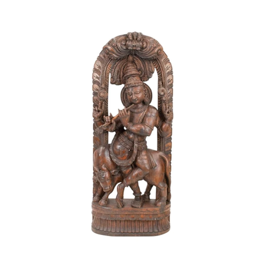 An Indian carved teak sculpture of Lord Krishna. 20th centur...
