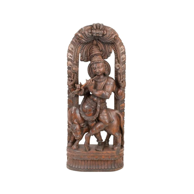 An Indian carved teak sculpture of Lord Krishna. 20th centur...