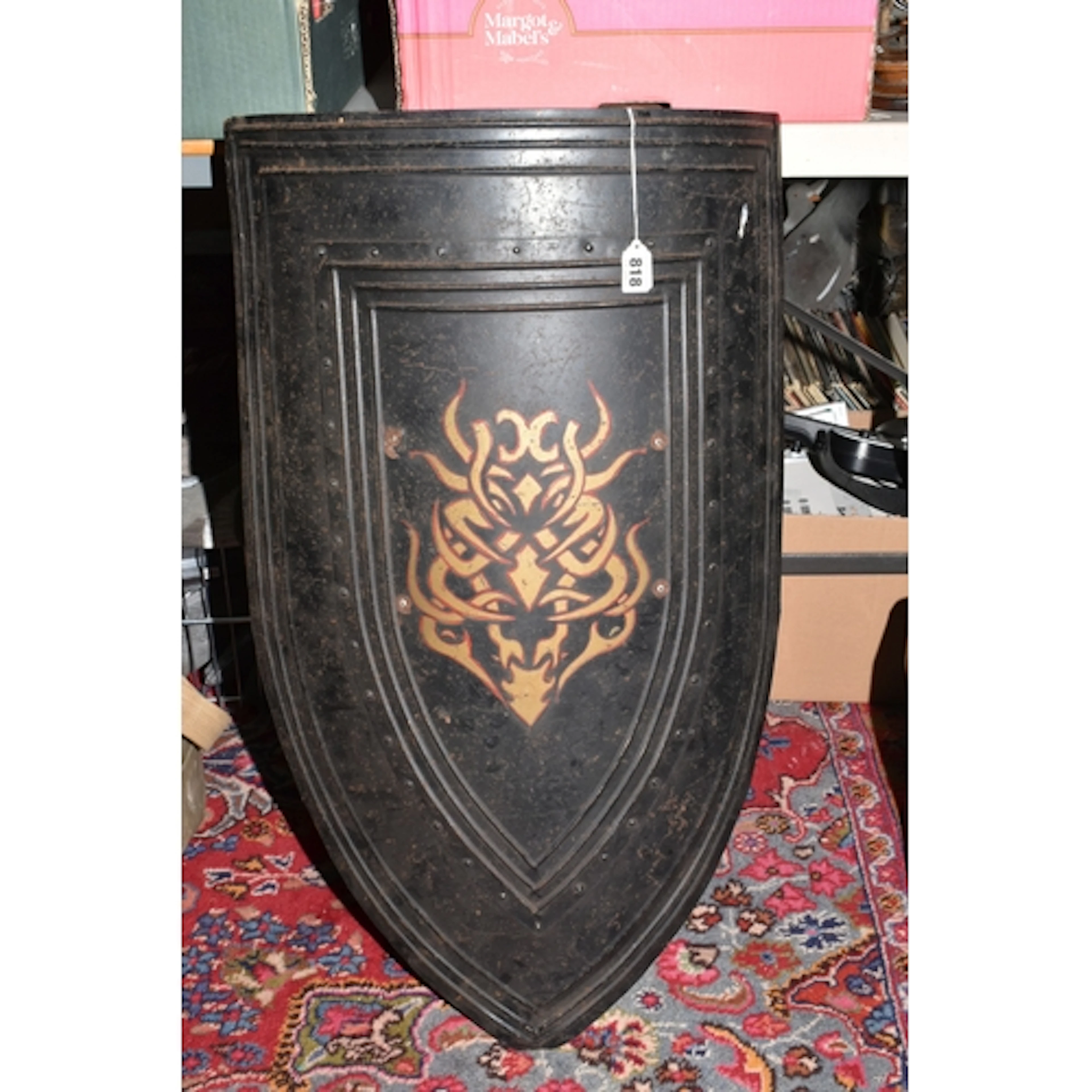 A LARGE CURVED METAL MEDIEVAL REENACTMENT SHIELD with leathe...