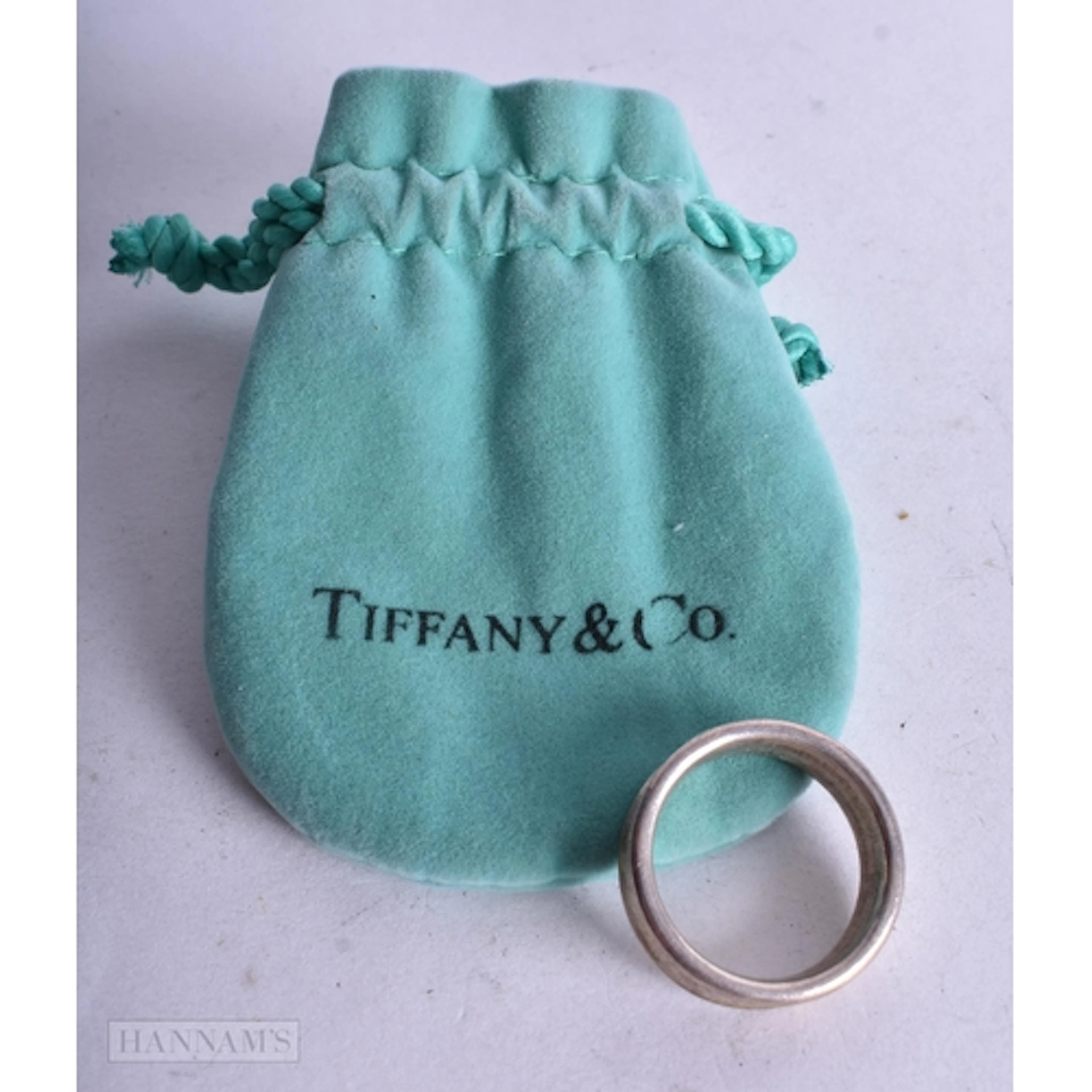 A TIFFANY & CO SILVER RING. Q. 6.1 grams. Q.