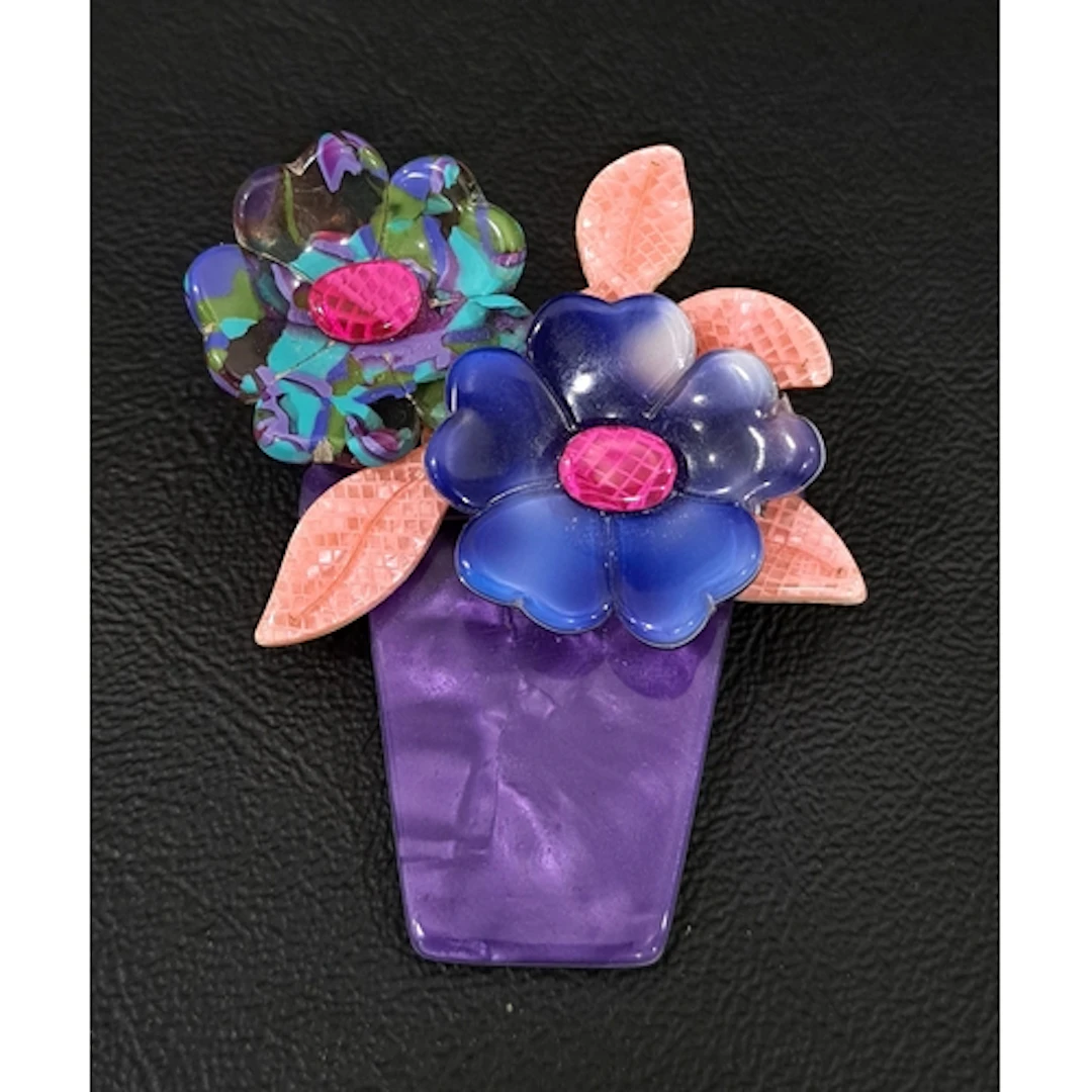 LEA STEIN FLOWER POT BROOCH the opalescent purple pot with o...