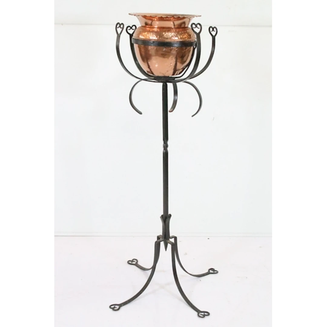 Arts and Crafts wrought iron and copper jardiniere, having h...