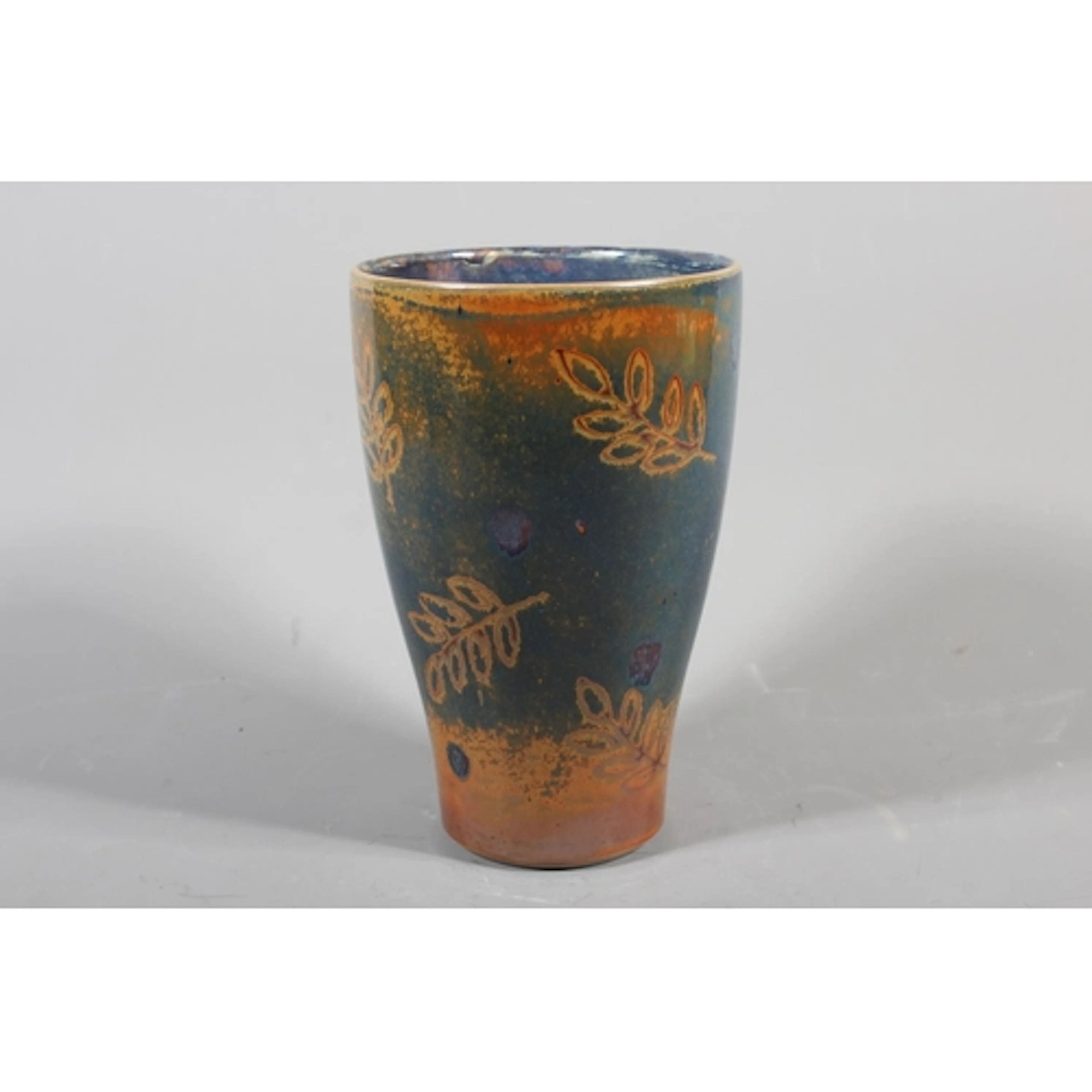 Studio pottery glazed vase with blue, copper, orange and lea...