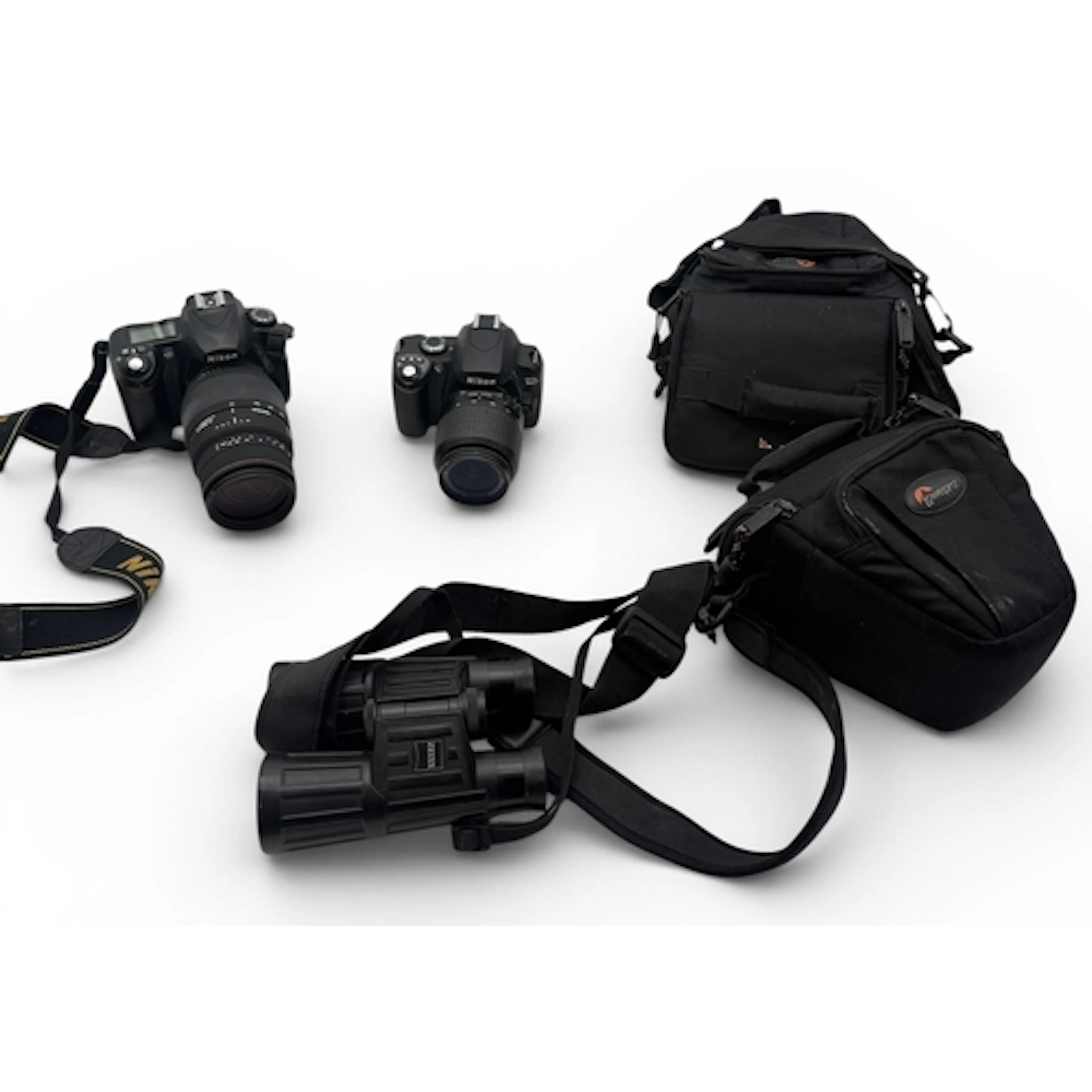 TWO NIKON CAMERAS AND A PAIR OF BINOCULARS