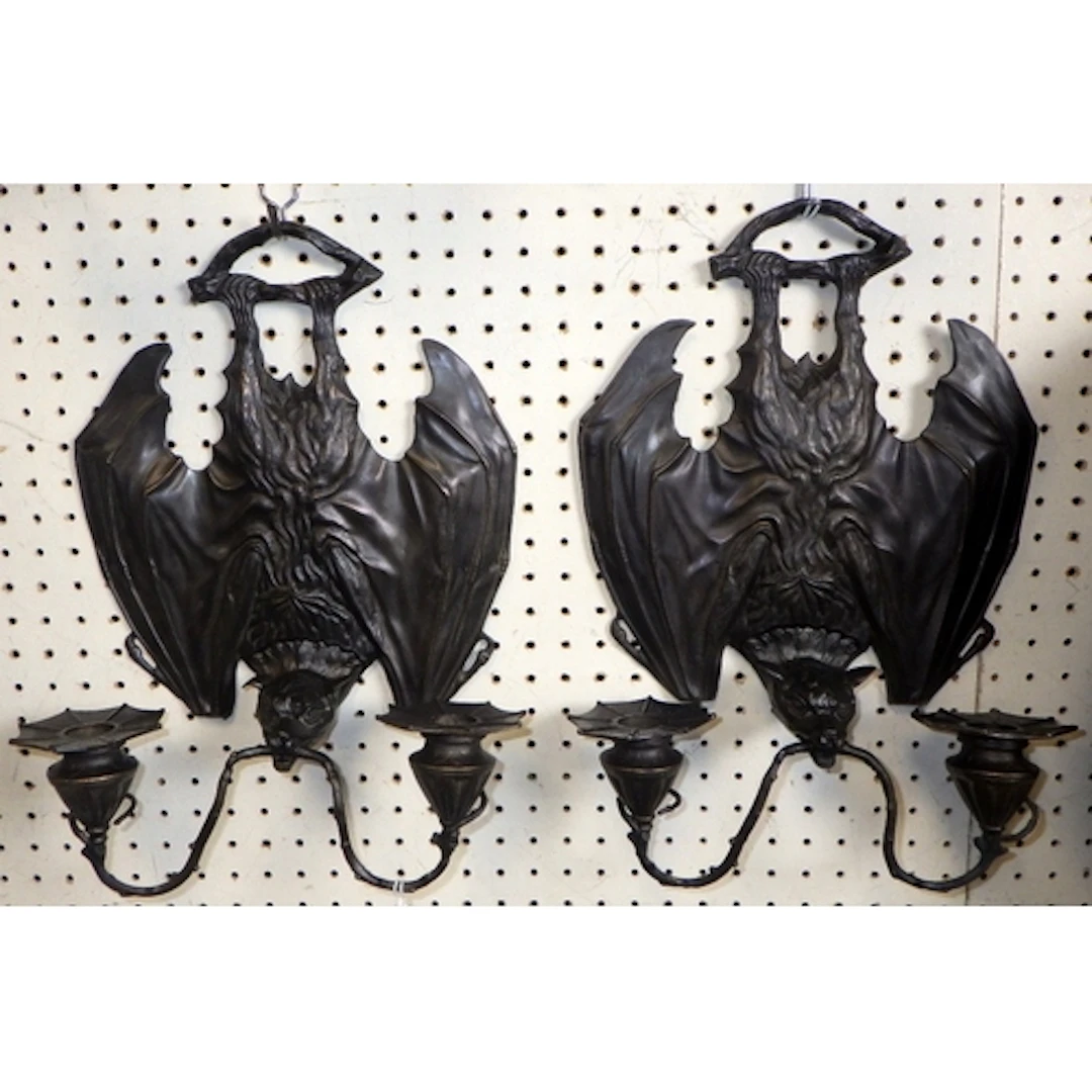 A pair of Art Nouveau style patinated bronze Gothic bat desi...