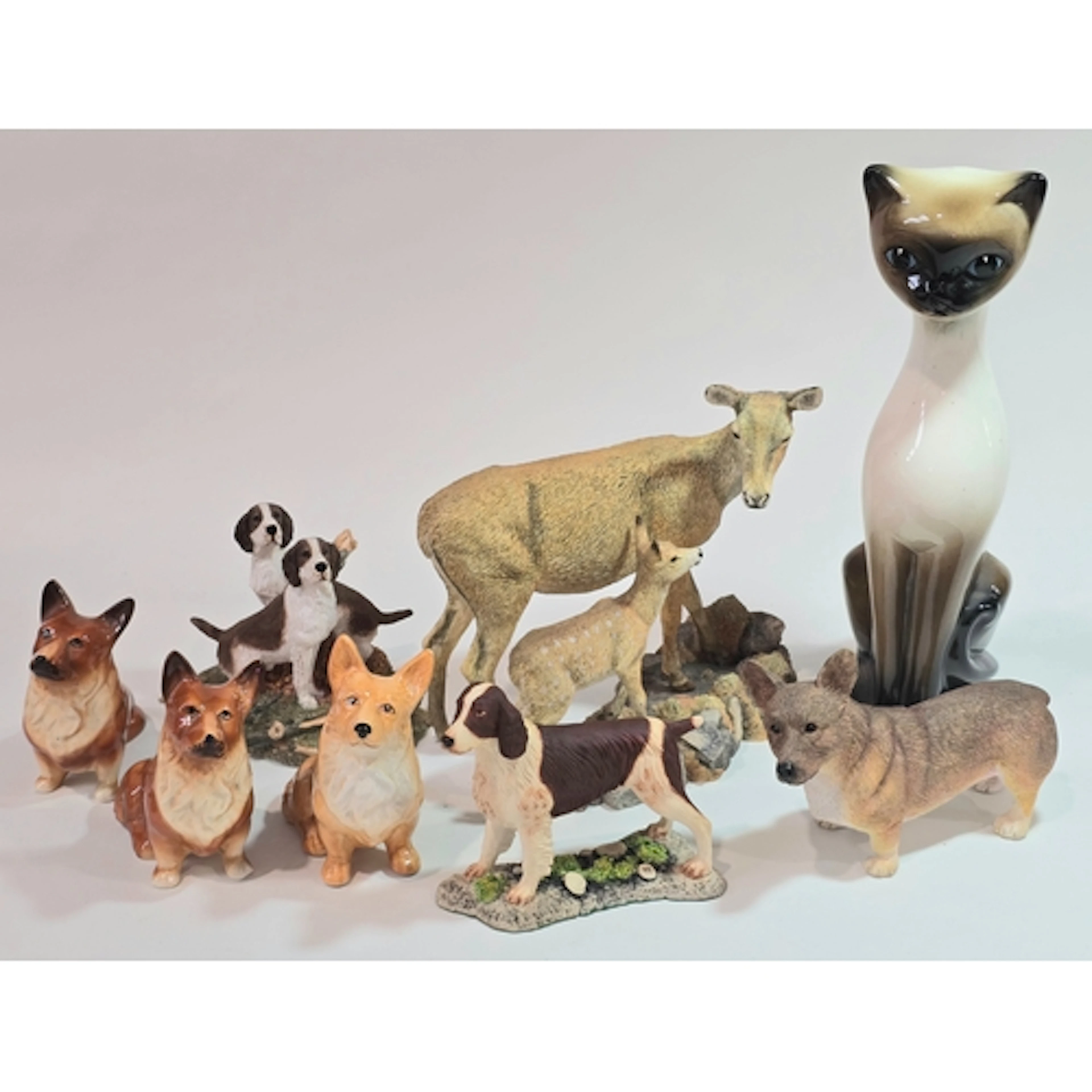 A collection of animal figurines to include a Country Artist...