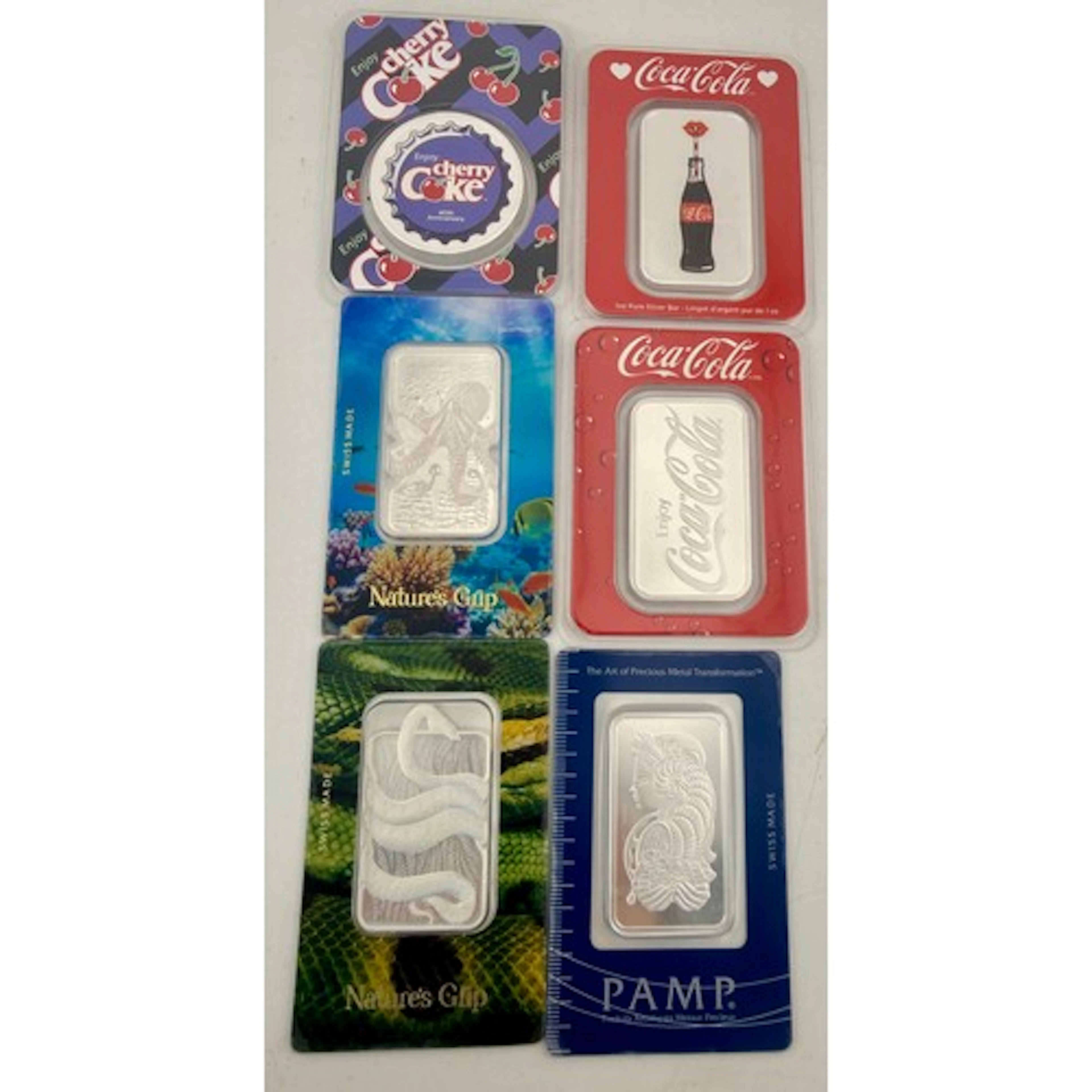 Six 999.9 1ozt bars to include Coca Cola and PAMP. 6 troy ou...