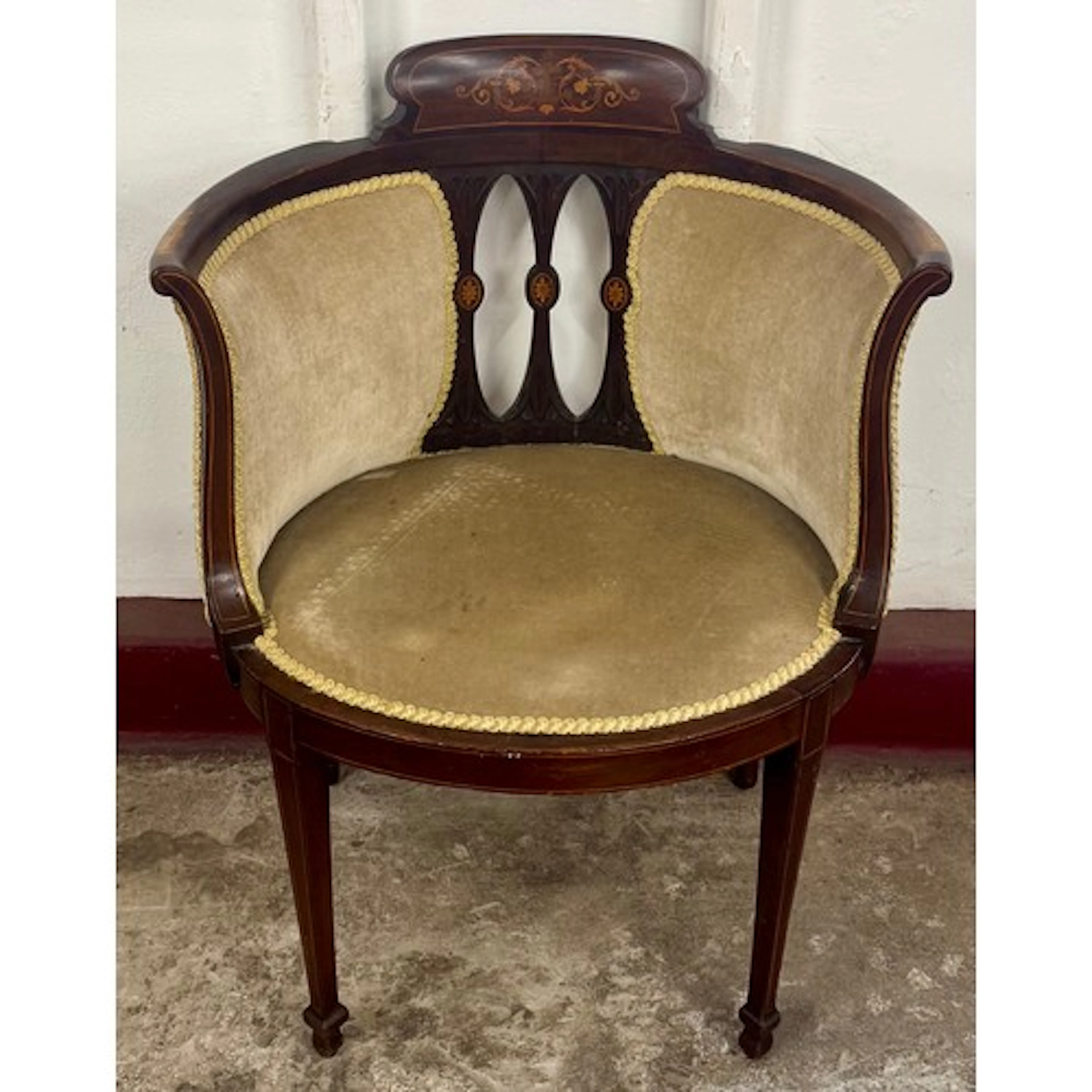 An Edward VII inlaid mahogany tub chair
