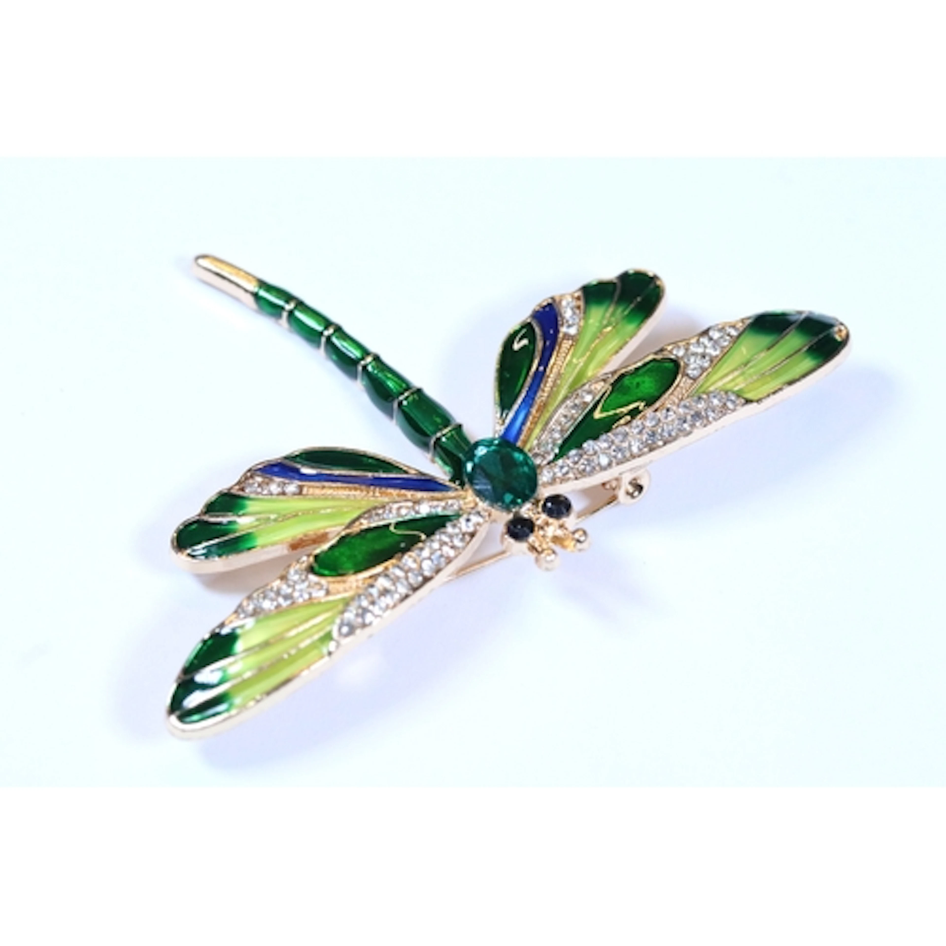 A contemporary gold tone brooch in the form of a dragonfly, ...