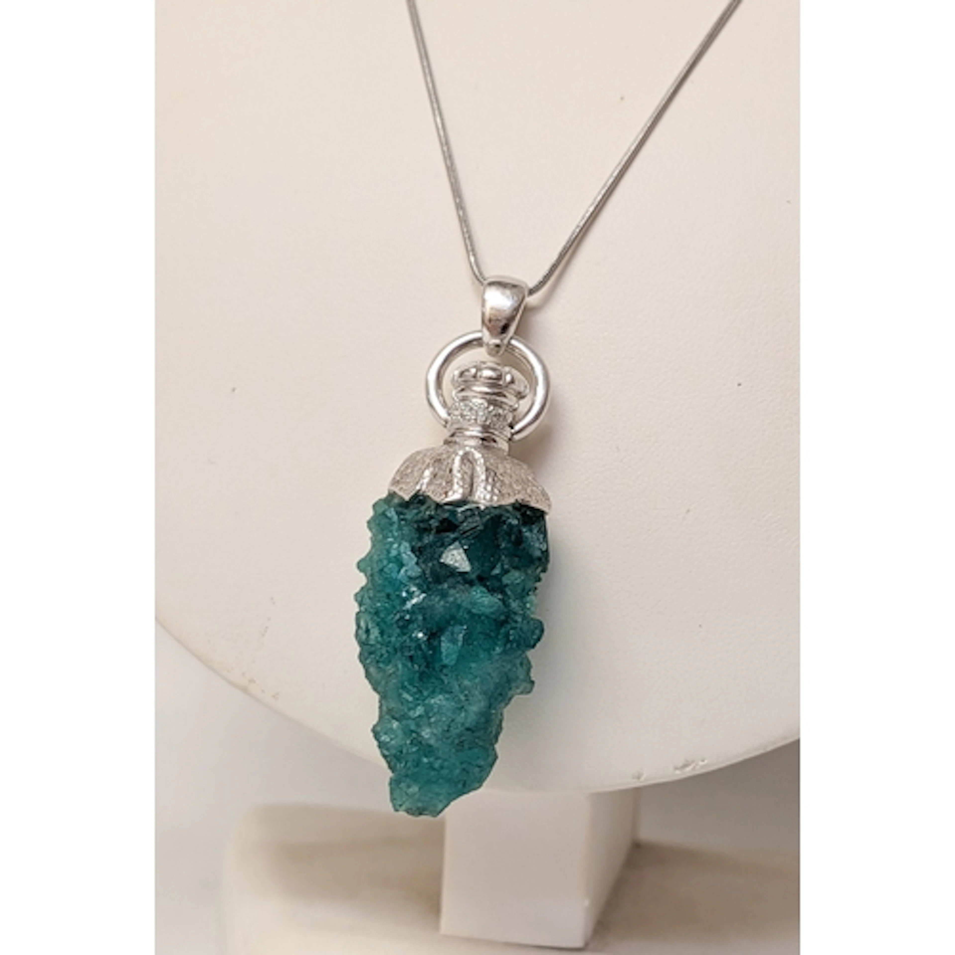 Unusual rough cut emerald stone, mounted in 18ct white gold ...