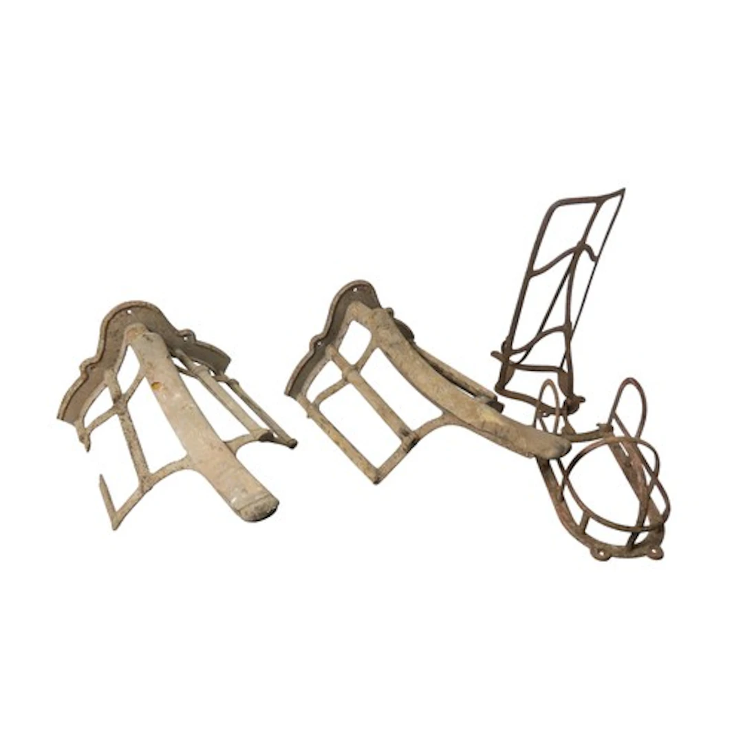 A PAIR OF VINTAGE CAST-IRON SADDLE RACKS EARLY 20TH CENTURY ...