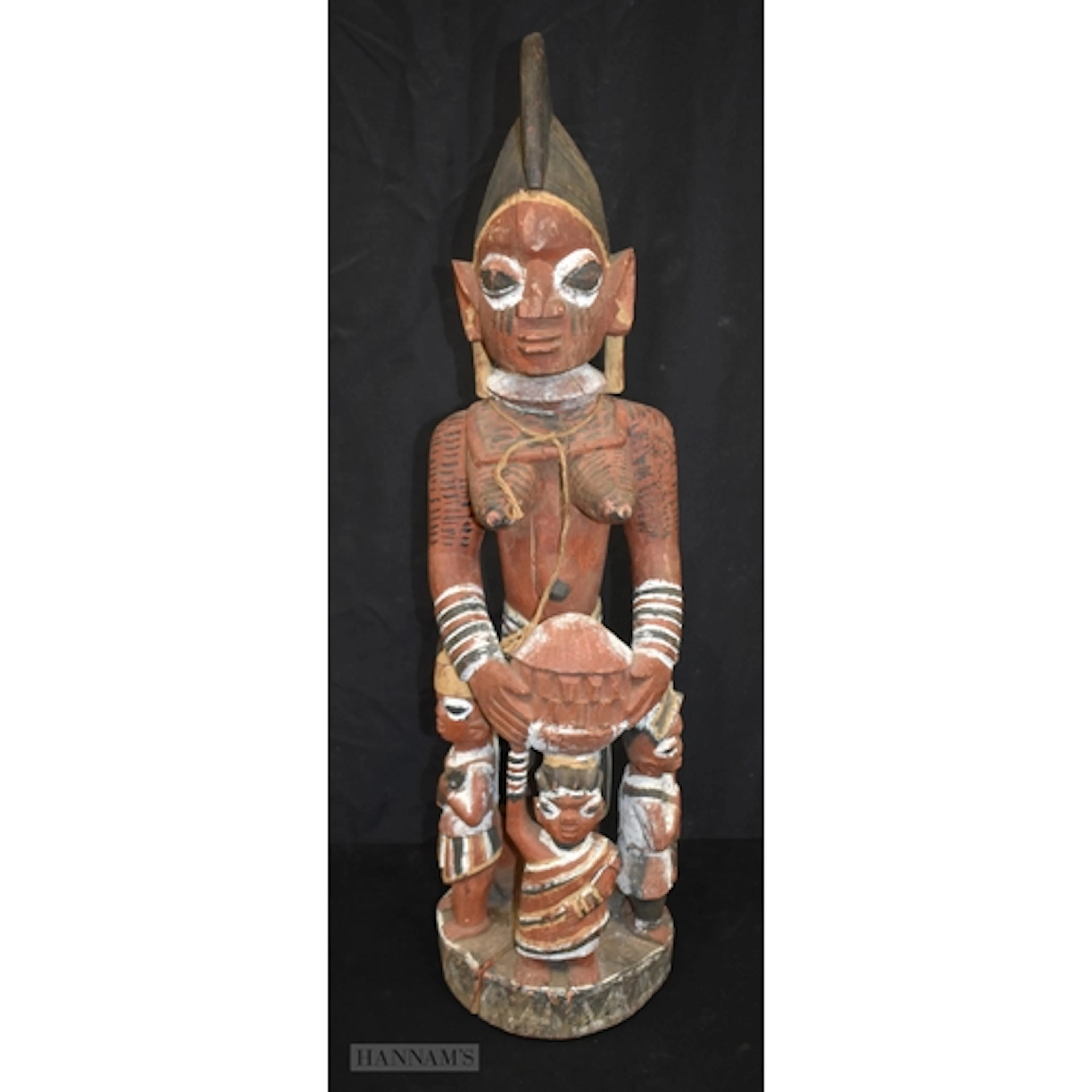 An African Yoruba carved wood maternity figure 85cm