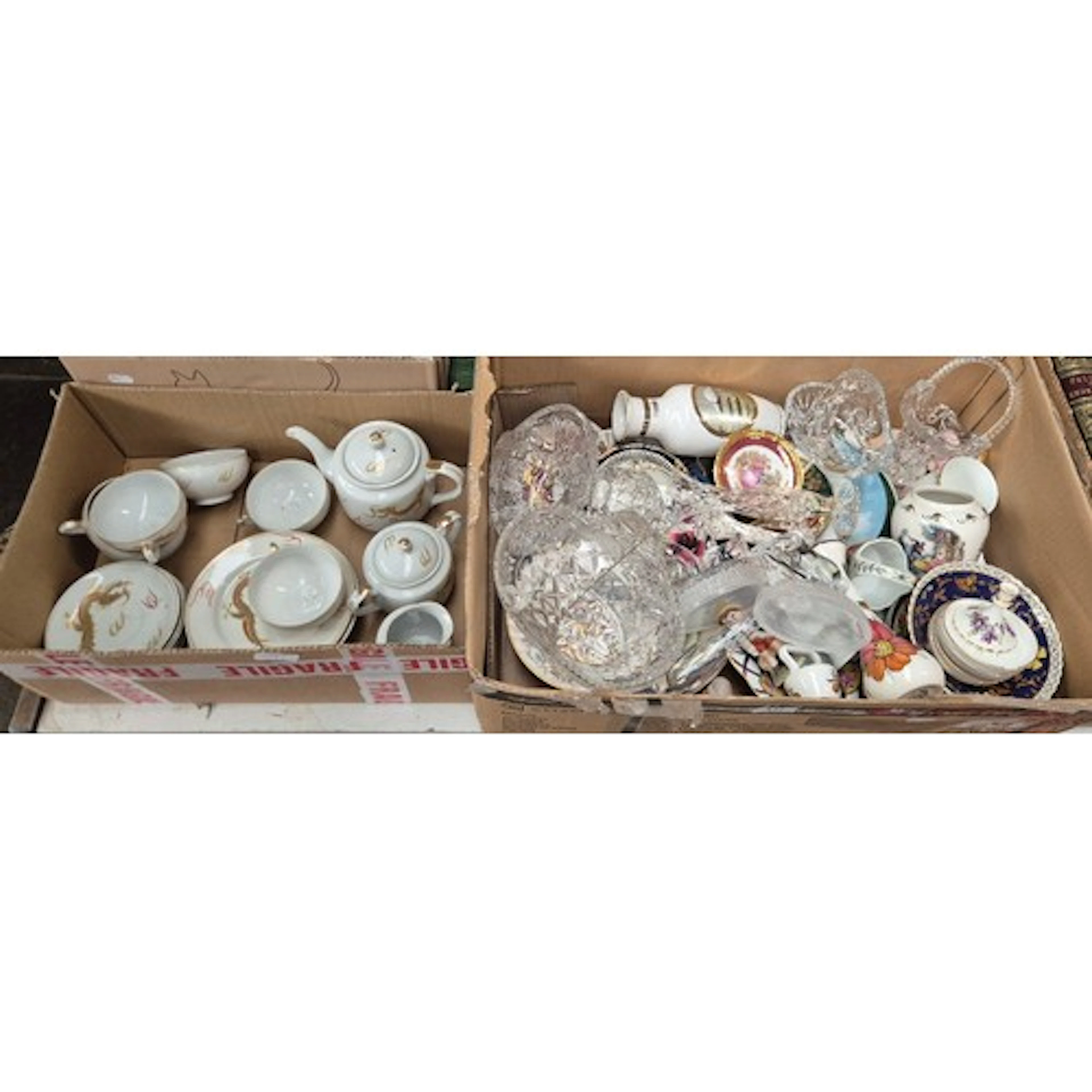 A box containing an oriental tea set and a box of mixed glas...