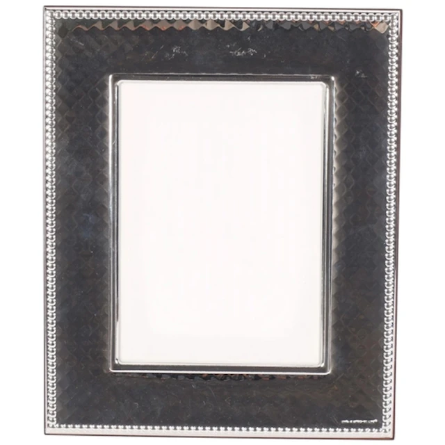 A modern diamond decorated silver-fronted photo frame, with ...